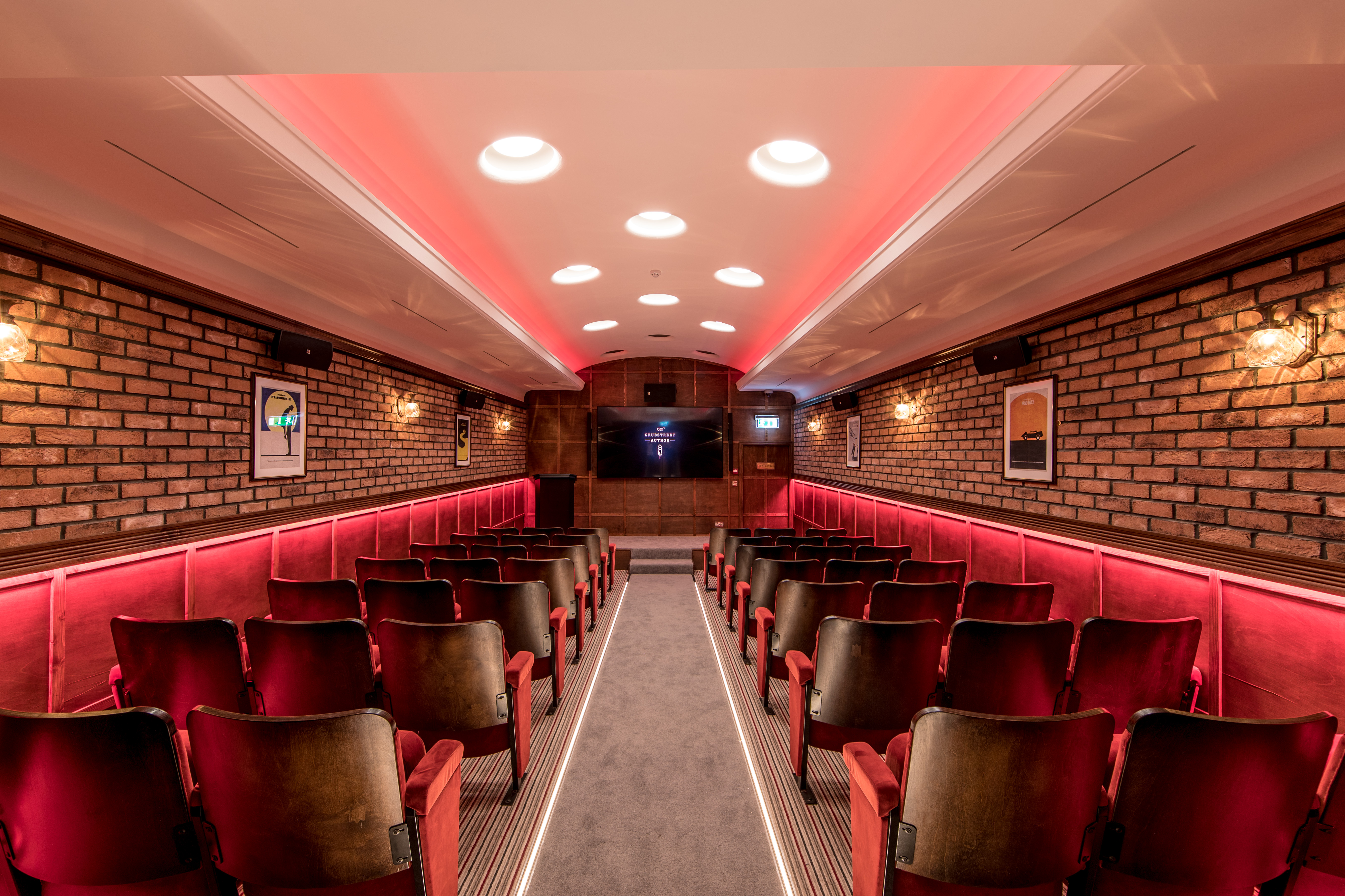 Intimate meeting space at Grubstreet Cellars with plush seating for corporate events.