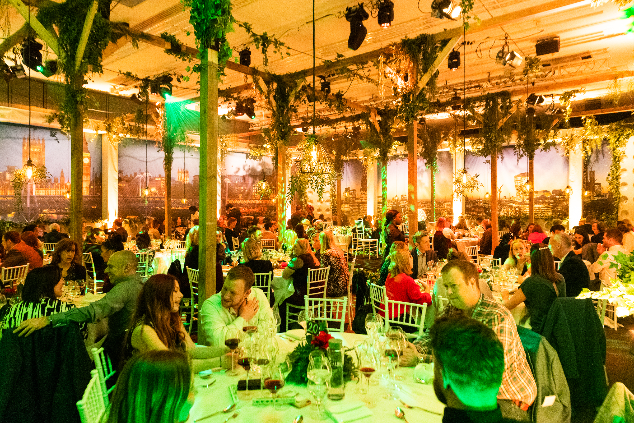 Elegant dinner event at Mountbatten, QEII Centre with lush greenery and ambient lighting.