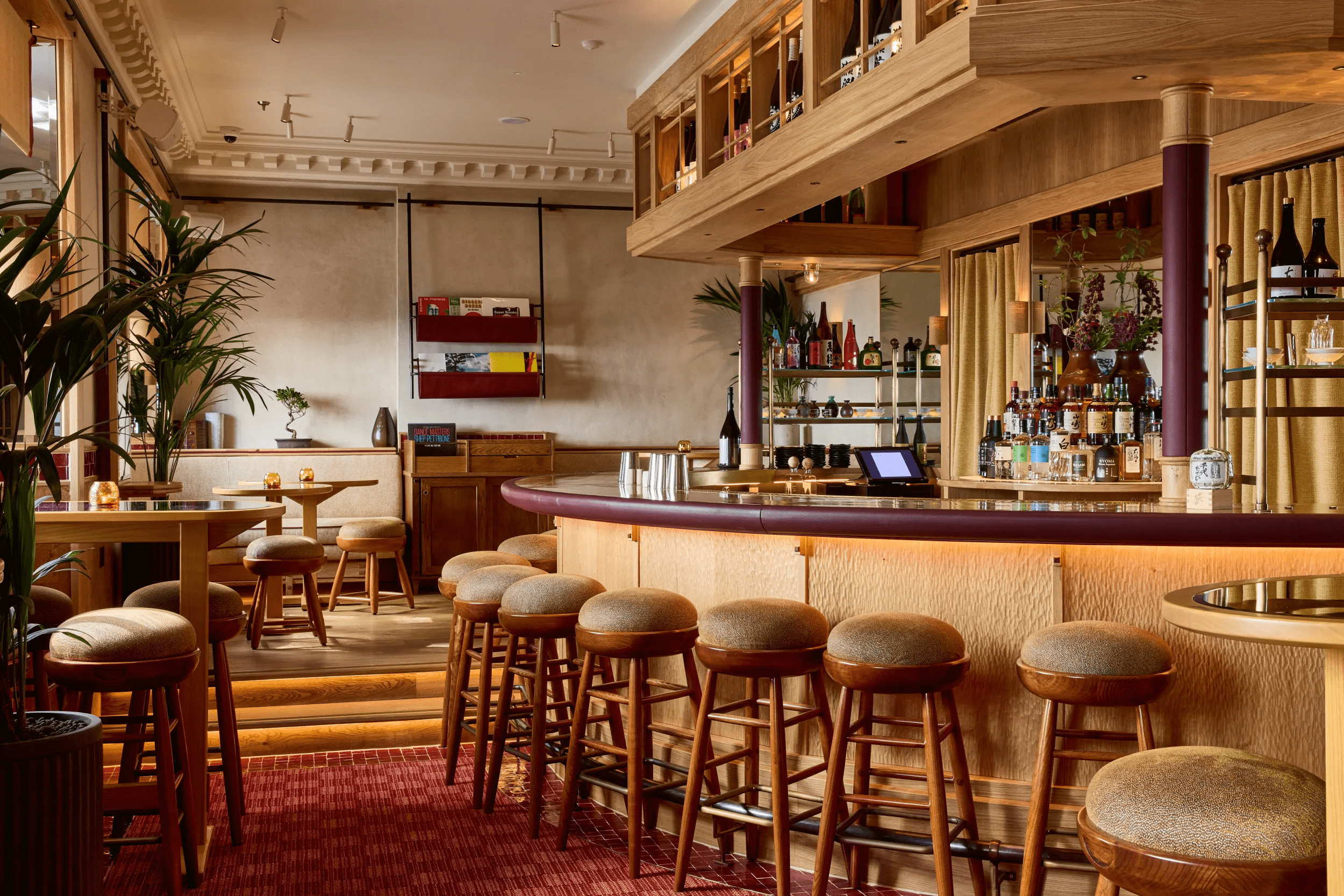 Stylish Kioku Bar with warm wood tones, ideal for networking events and cocktail receptions.