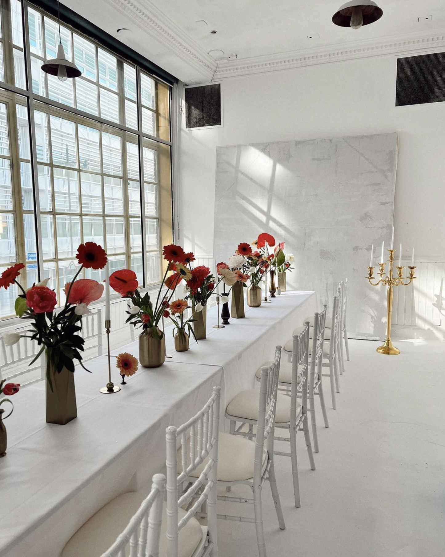 Elegant event space with floral centerpieces, perfect for upscale meetings and celebrations.