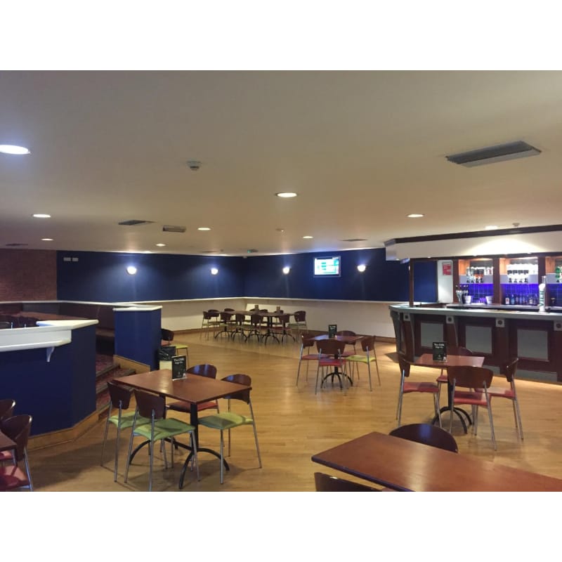 Function room at Powerleague Slough with modern bar, ideal for networking events and conferences. - Banner