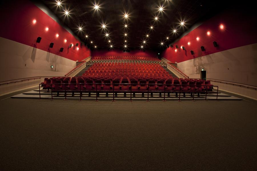 Spacious auditorium with tiered seating at ODEON LUXE Birmingham for events and presentations.
