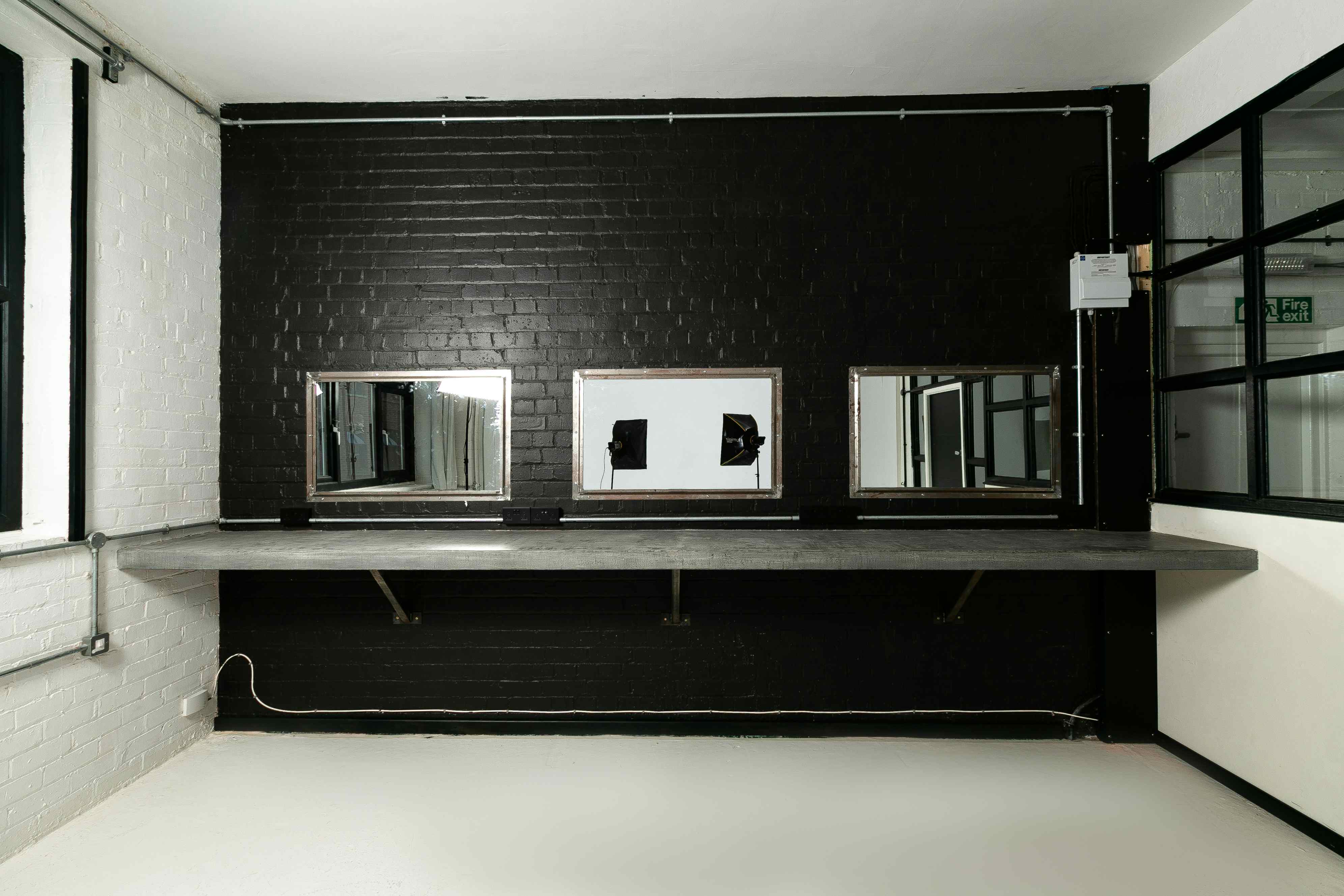 Modern restroom in Spectrum Studios, featuring sleek mirrors for upscale events.