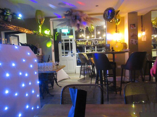 Cozy event space at The Delph Restaurant & Bar for celebrations, elegant decor and lighting.