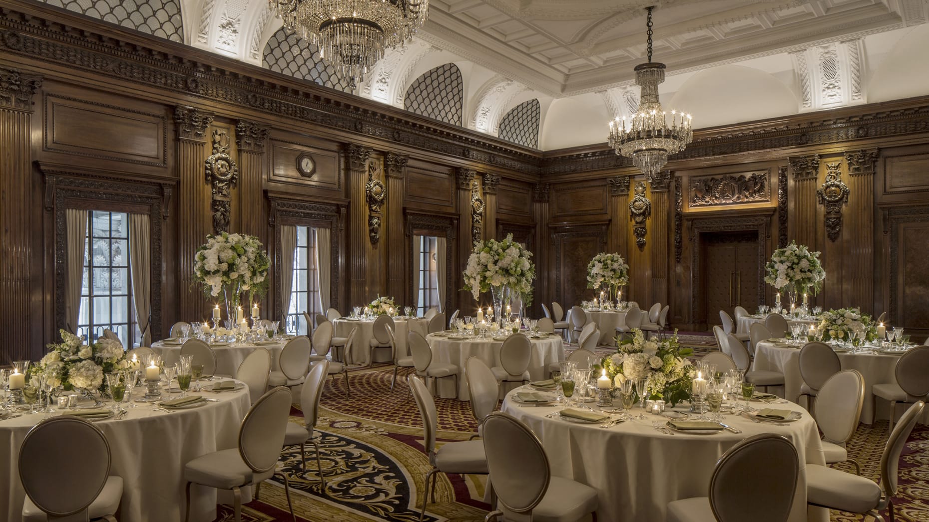 Elegant UN Ballroom with ornate chandeliers, ideal for weddings and corporate events.