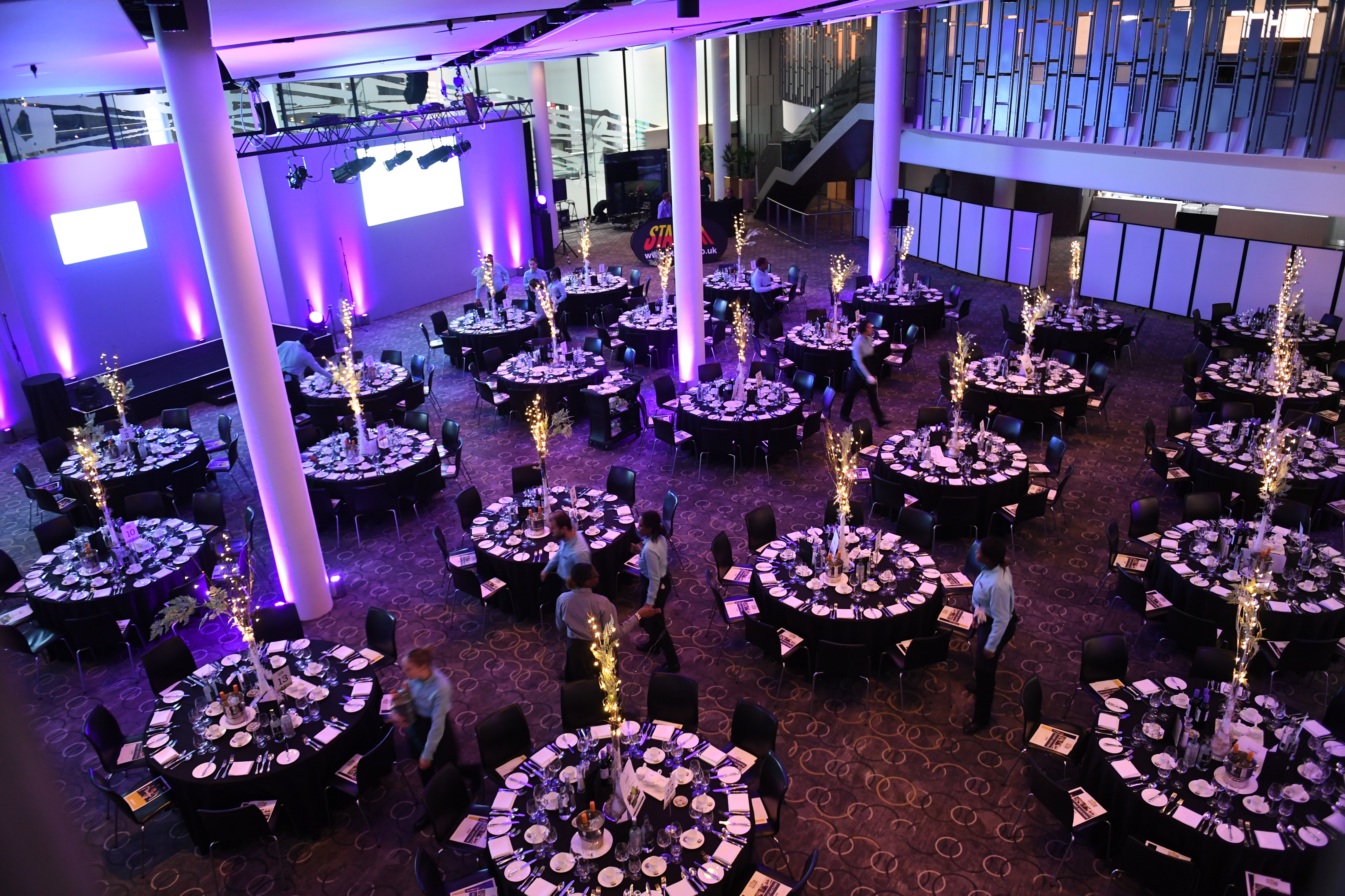 Bobby Moore Room at Wembley Stadium set for a formal dinner event with elegant tables.