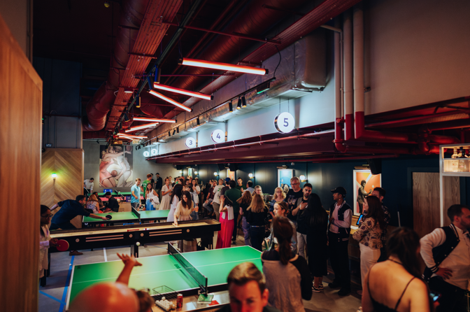Vibrant event space with ping pong tables at Bounce Battersea Power Station for corporate gatherings.