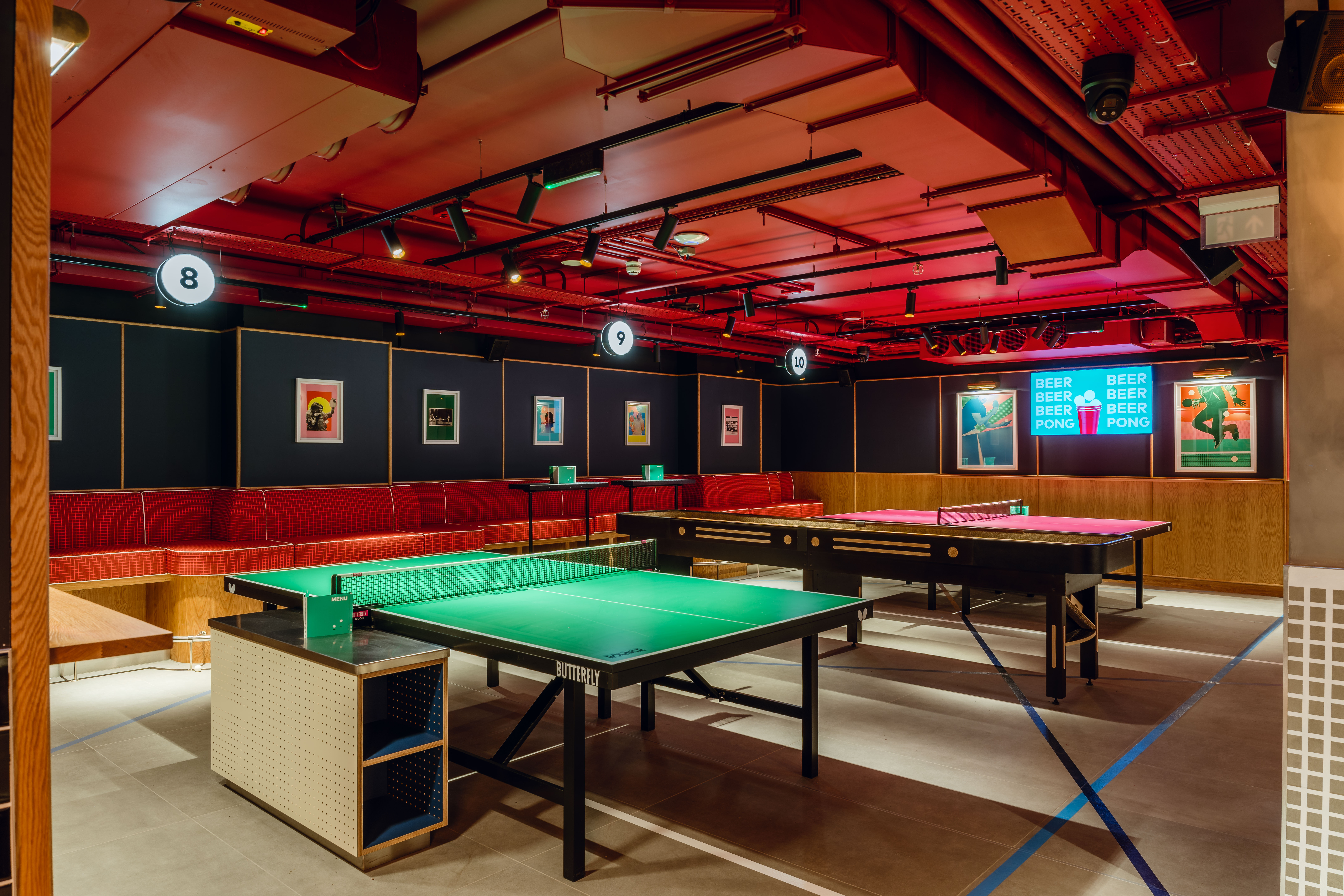 Modern event space with ping pong tables at Bounce Battersea for corporate gatherings. - Banner