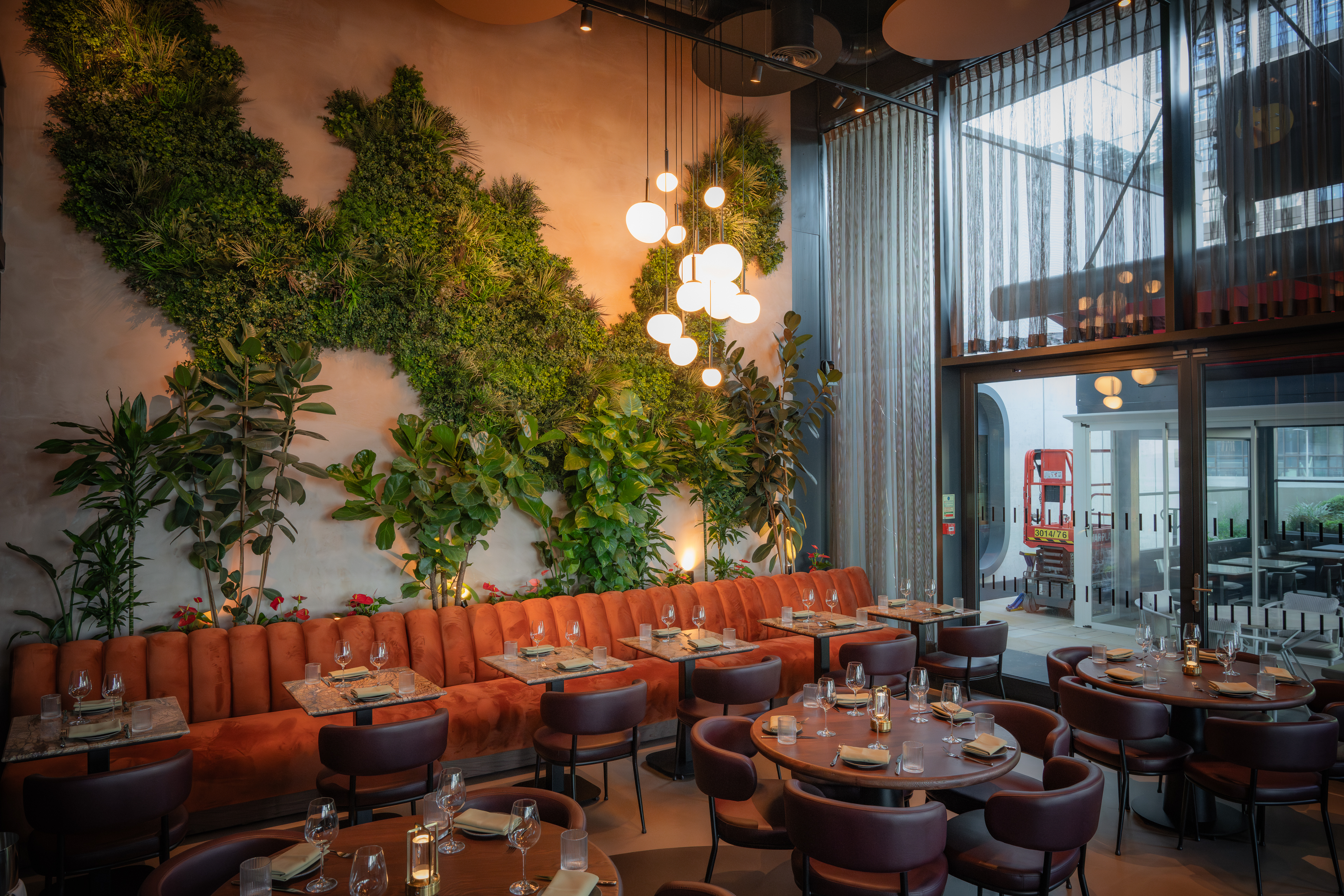 Edena Room at HERA Restaurant: modern decor, lush greenery for events and gatherings. - Banner