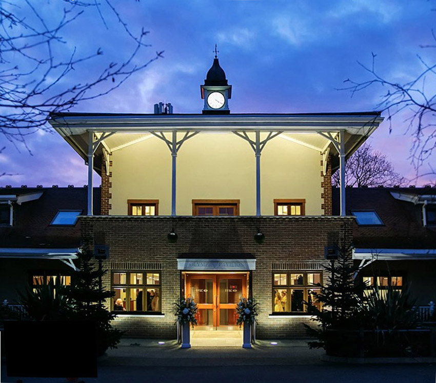 Olympic Pavilion at dusk, featuring a clock tower, ideal for weddings and events.