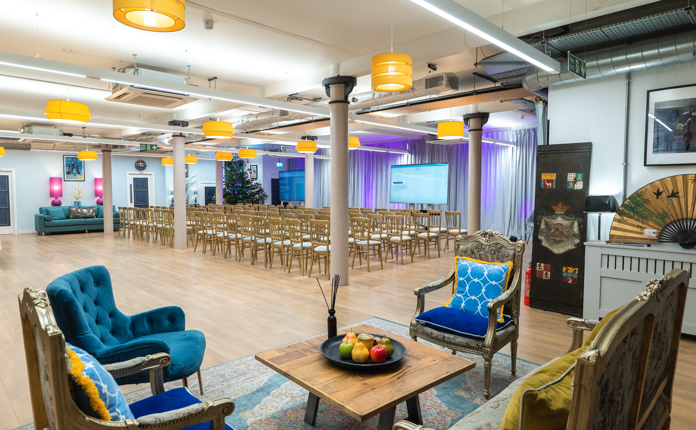 Versatile event space with elegant seating and stage for networking or social events.