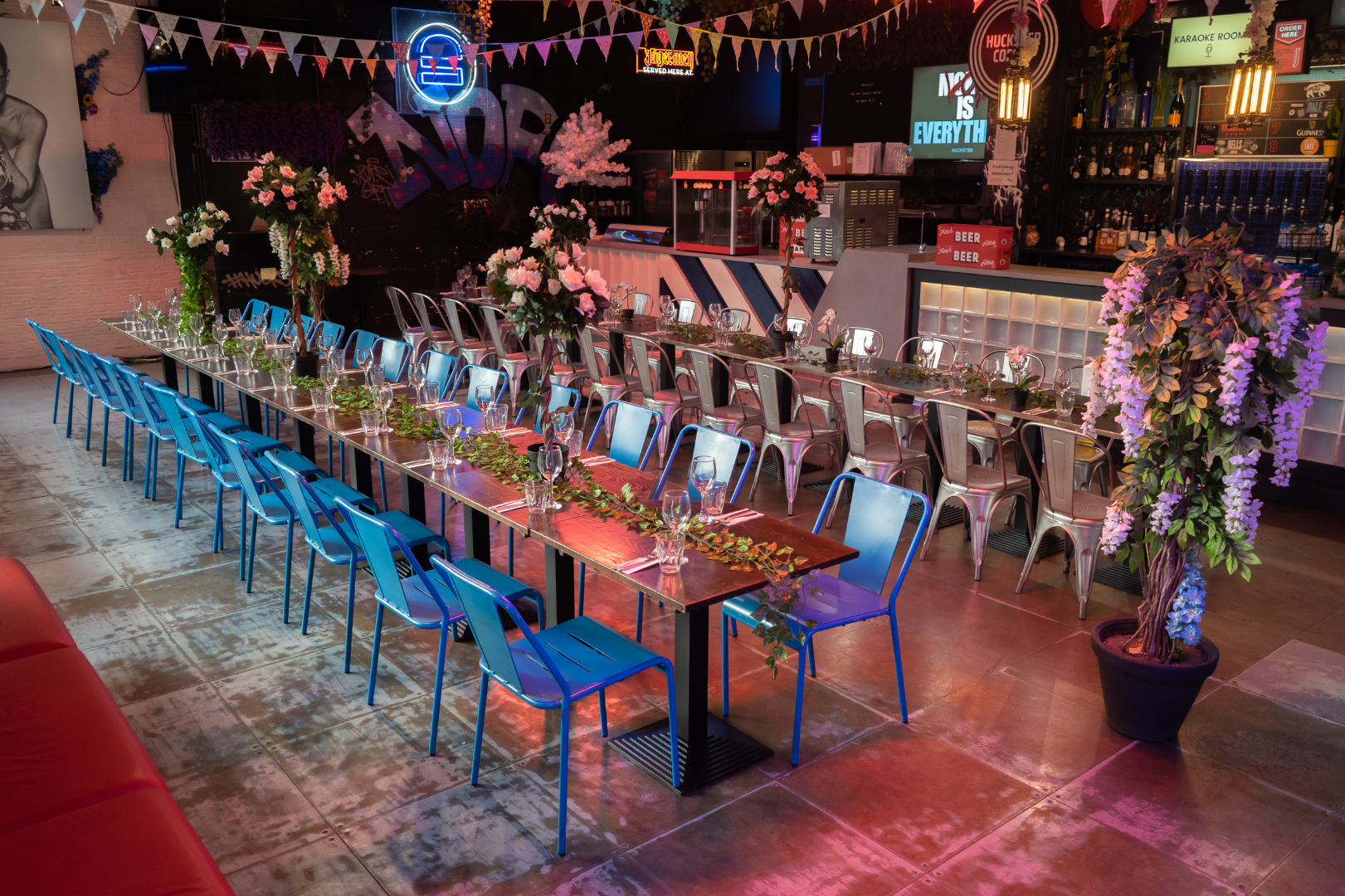 Elegant event space with greenery, perfect for networking and celebrations in HUCKSTER London.