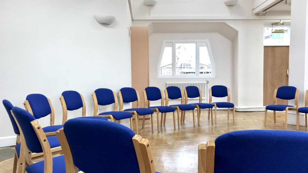Blue chairs in a bright studio for workshops and brainstorming sessions at Rudolf Steiner House.