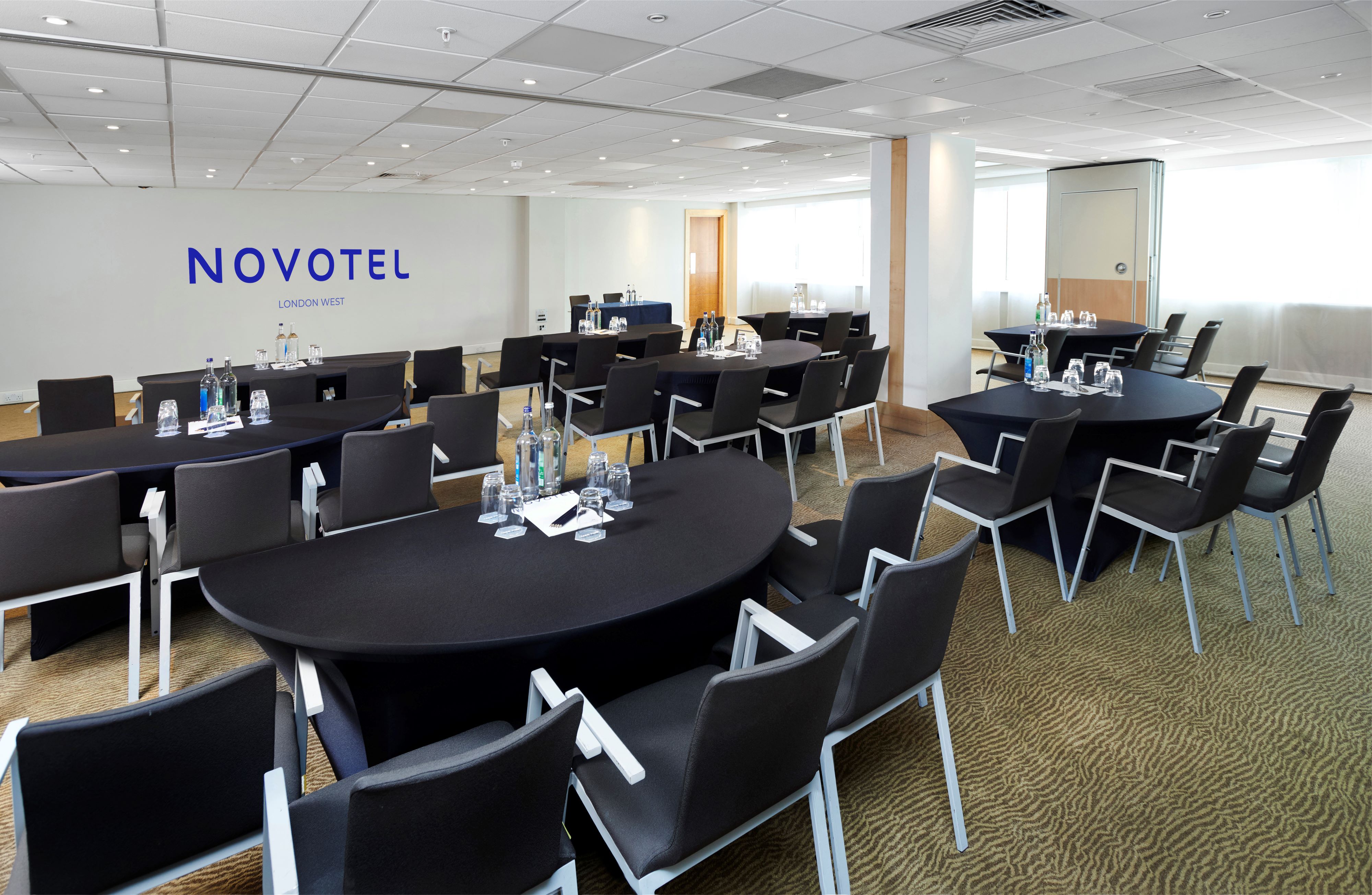 Fronsac meeting room at Novotel London West, set for a corporate event with round tables.
