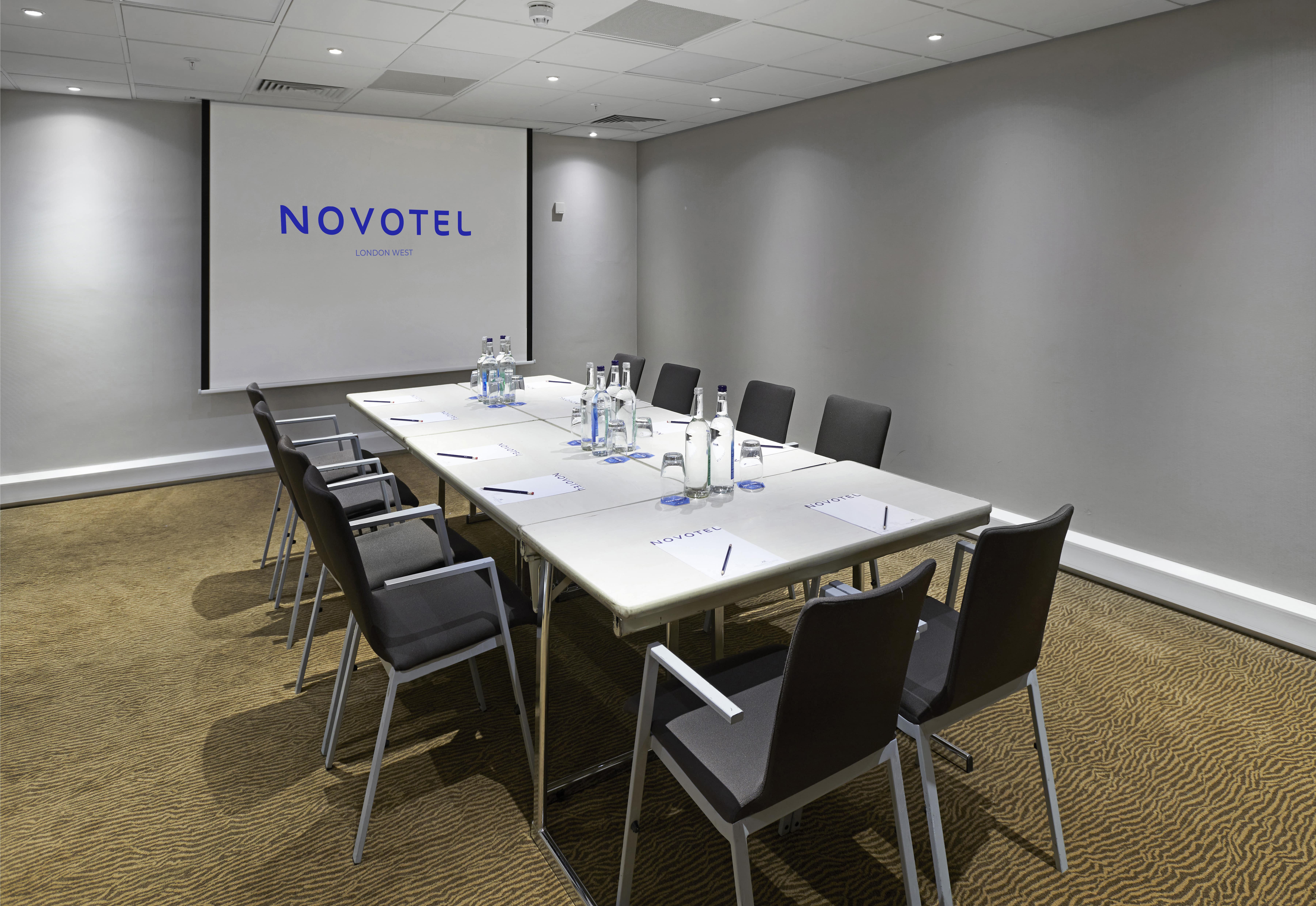 Modern meeting room in Novotel London West, ideal for corporate workshops and presentations.