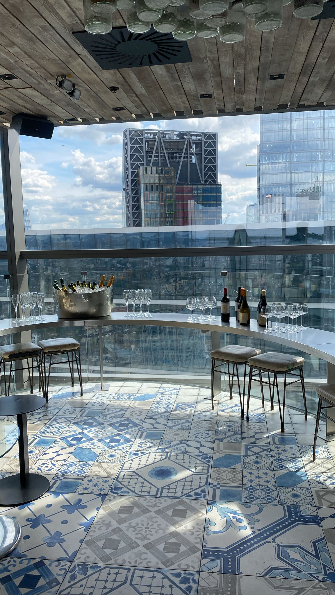 Semi-private bar event at Duck & Waffle with stylish setup and panoramic city view.