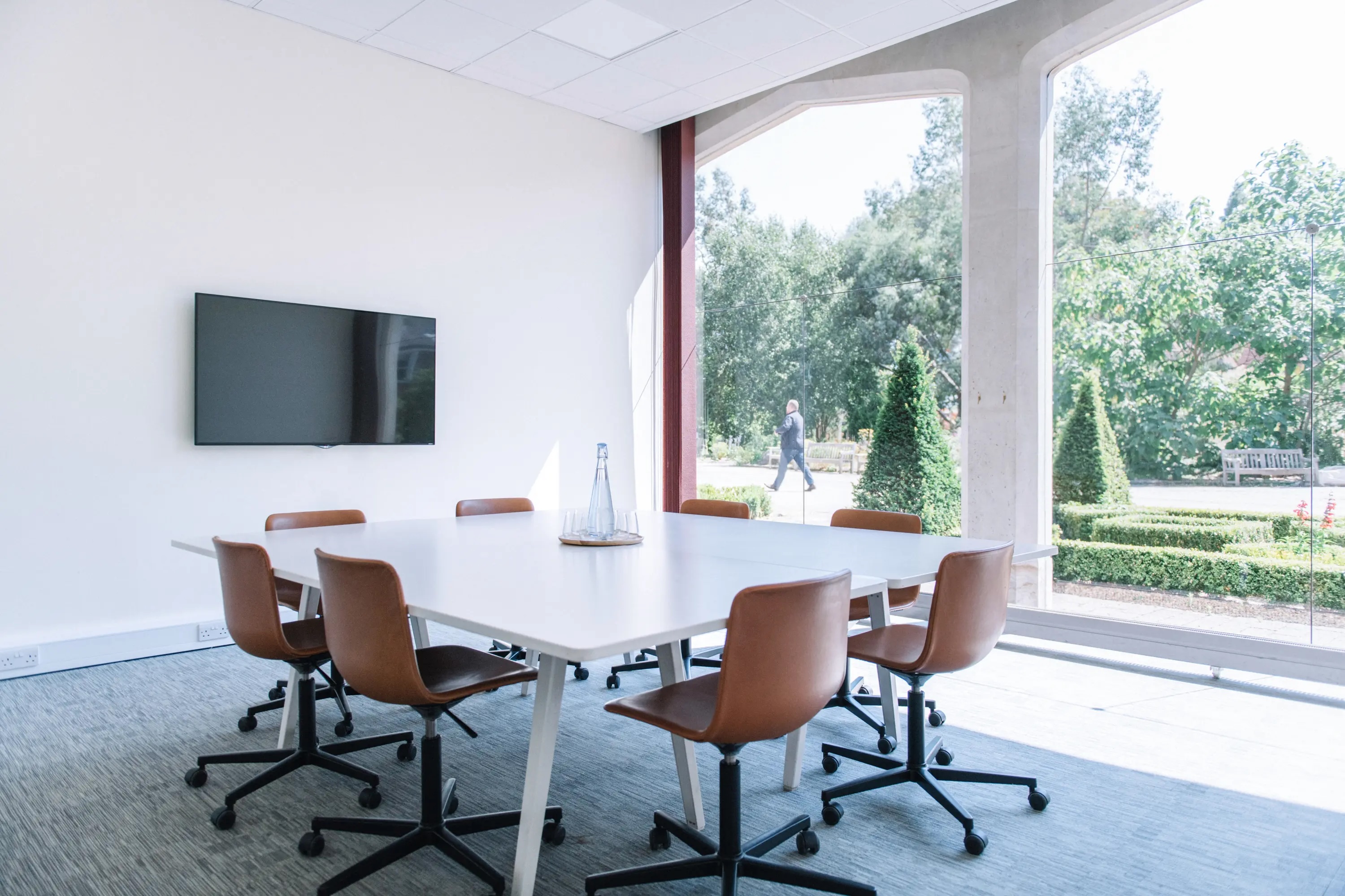 Modern meeting room in Ashridge House with ergonomic chairs and natural light.