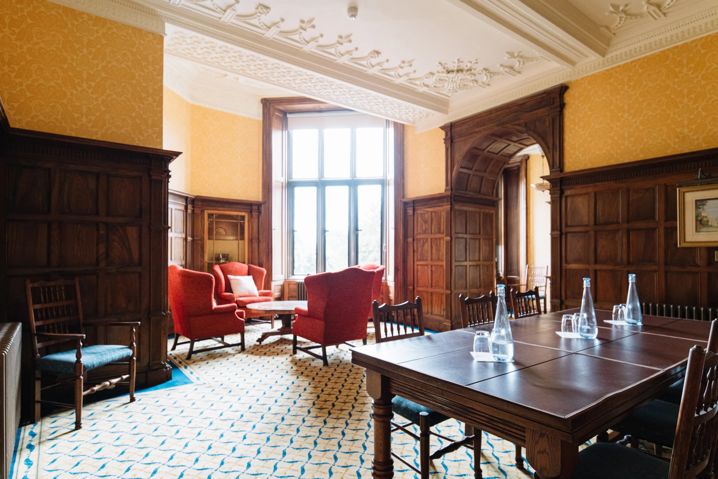 Elegant meeting room in Ashridge House with wood paneling, ideal for corporate events.