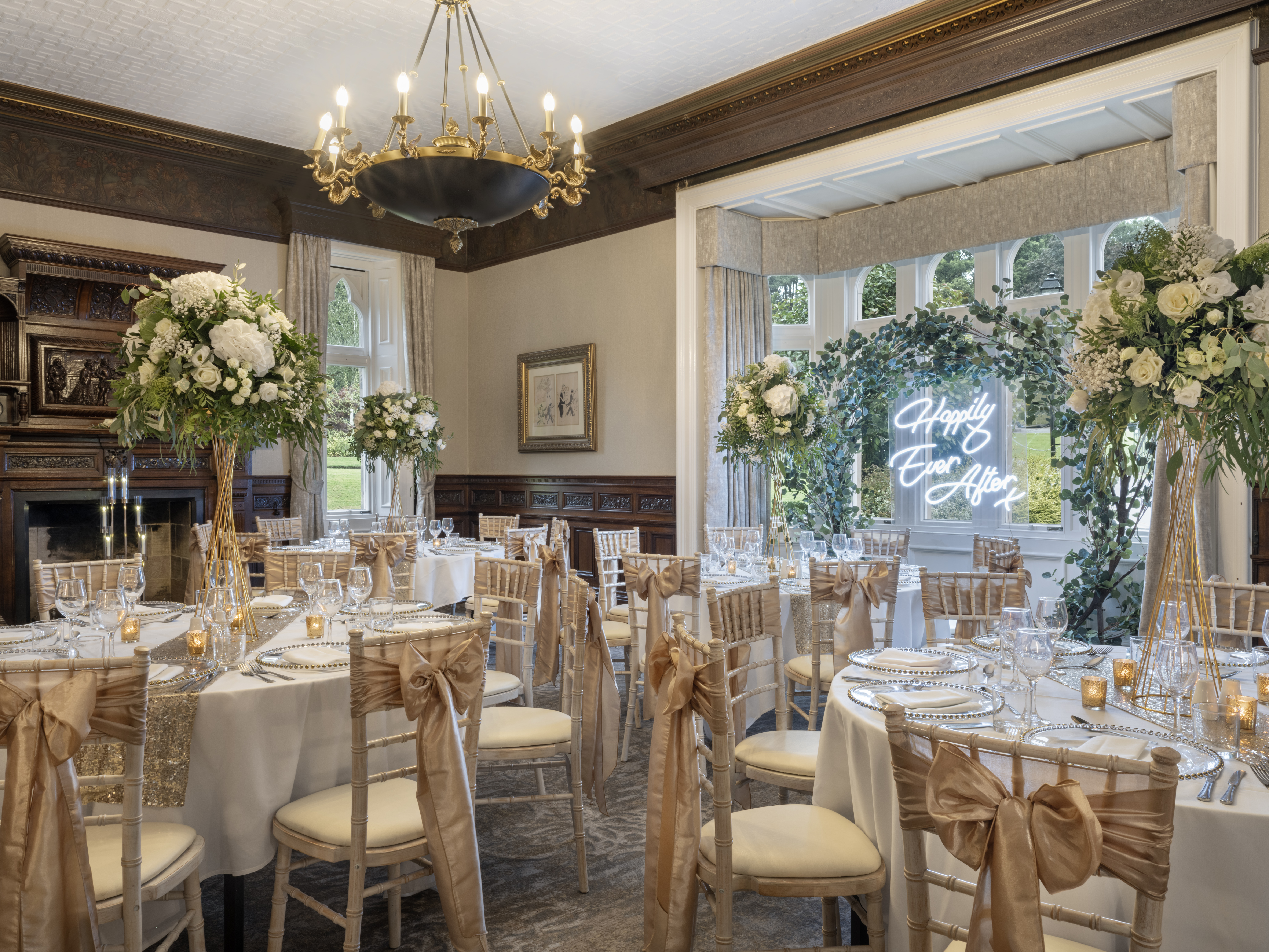 Elegant banquet room with floral centerpieces for weddings and corporate events.