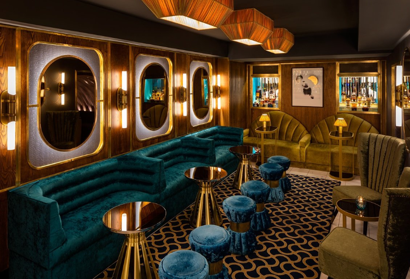 Private dining at Drip London lounge with moody lighting for VIP networking and cocktail events. - Banner