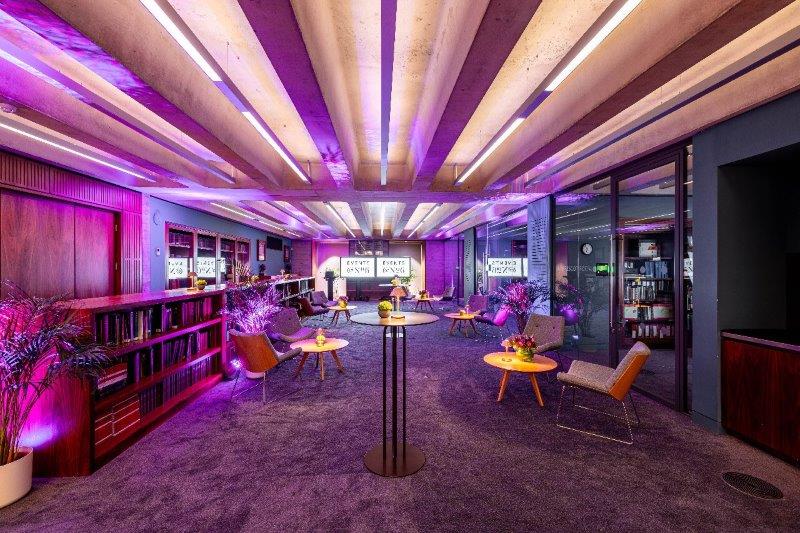 Modern Library Meeting Room with ambient lighting for corporate meetings and creative events.