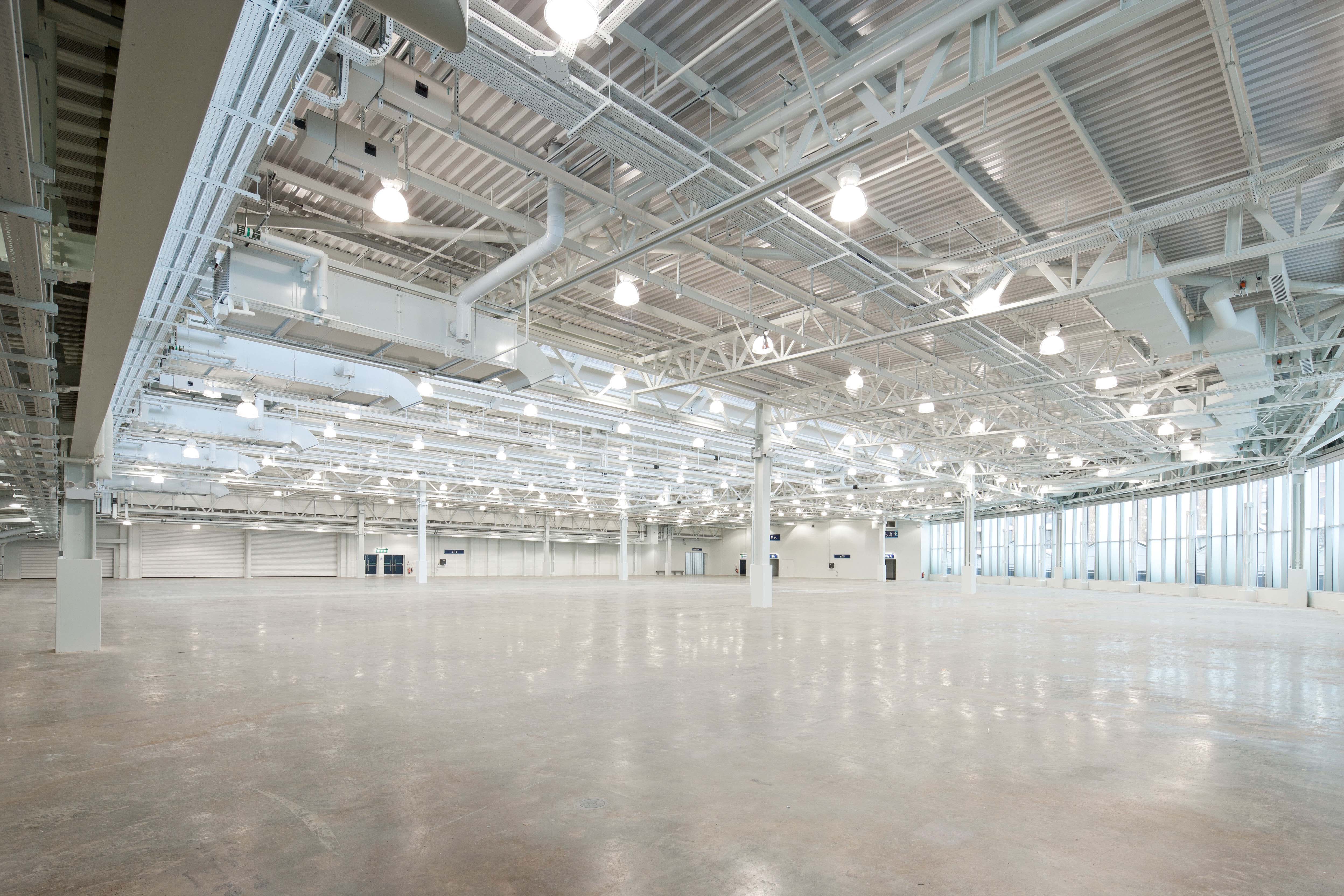 Spacious West Hall venue with high ceilings, ideal for conferences and exhibitions.