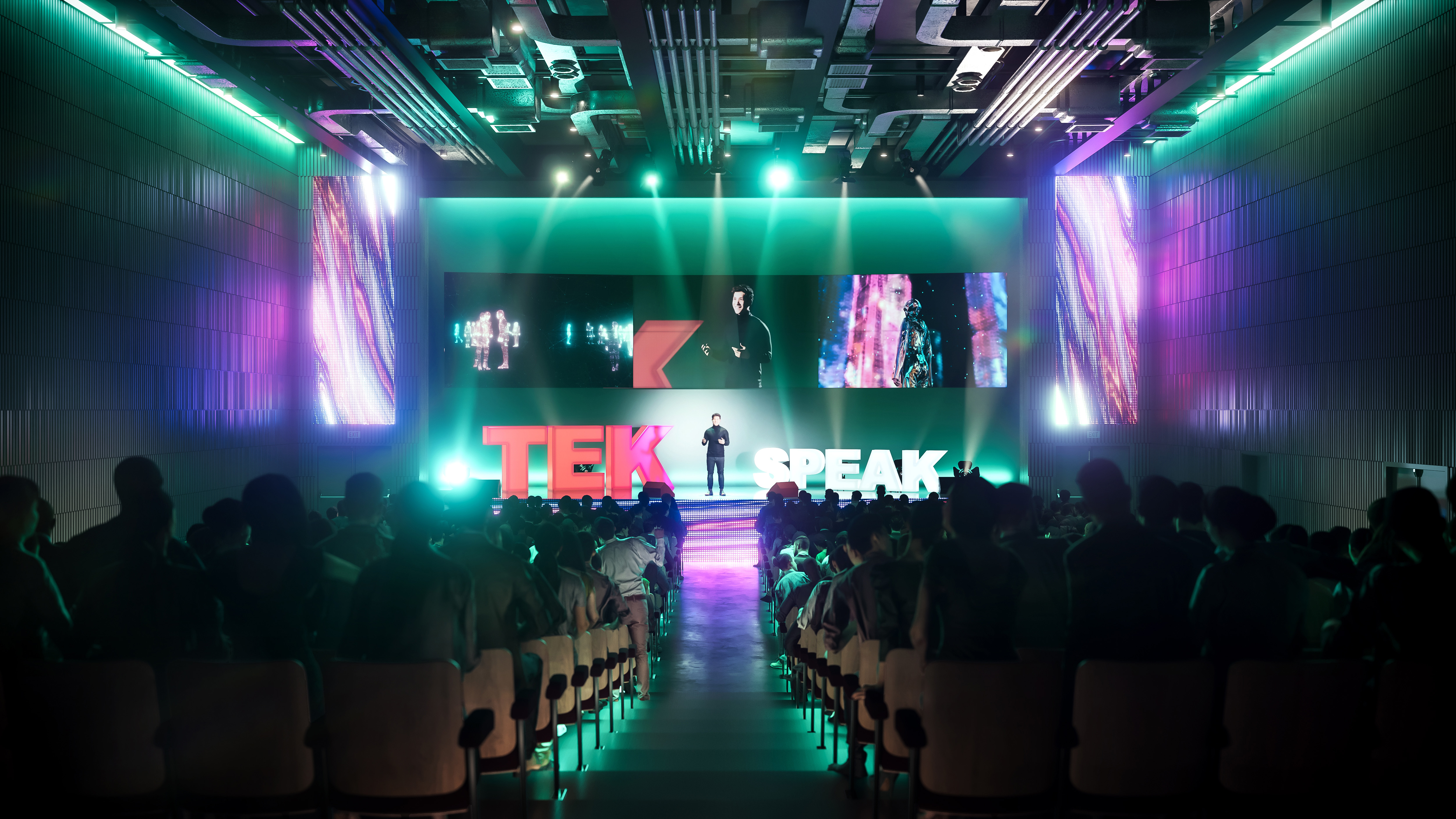 Dynamic conference at International Convention Centre with vibrant lighting and engaging visuals. - Banner