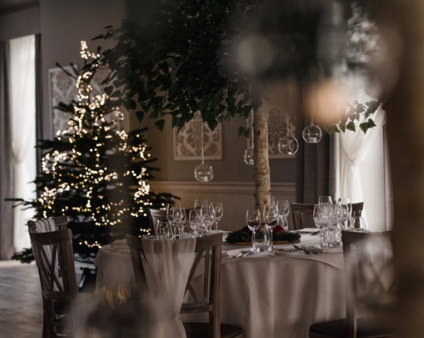 Christmas party table with elegant decor and festive tree in Old Palace Chester.