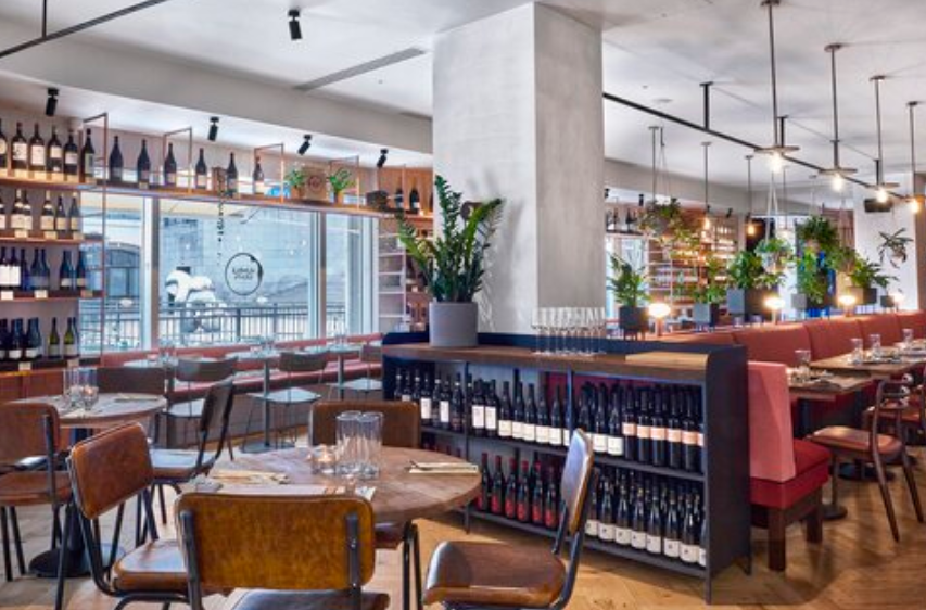 Private dining room at Humble Grape Canary Wharf for corporate events and networking dinners. - Banner