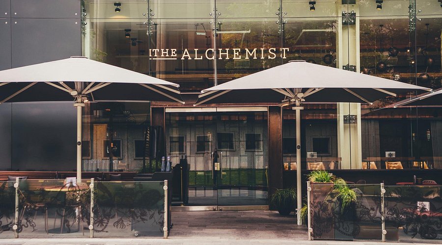 Modern Alchemist cocktail bar with patio for networking events and brand activations.