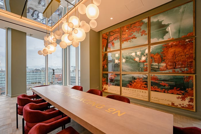 Luxury boardroom with statement chandelier for executive off-sites and VIP strategy sessions. - Banner