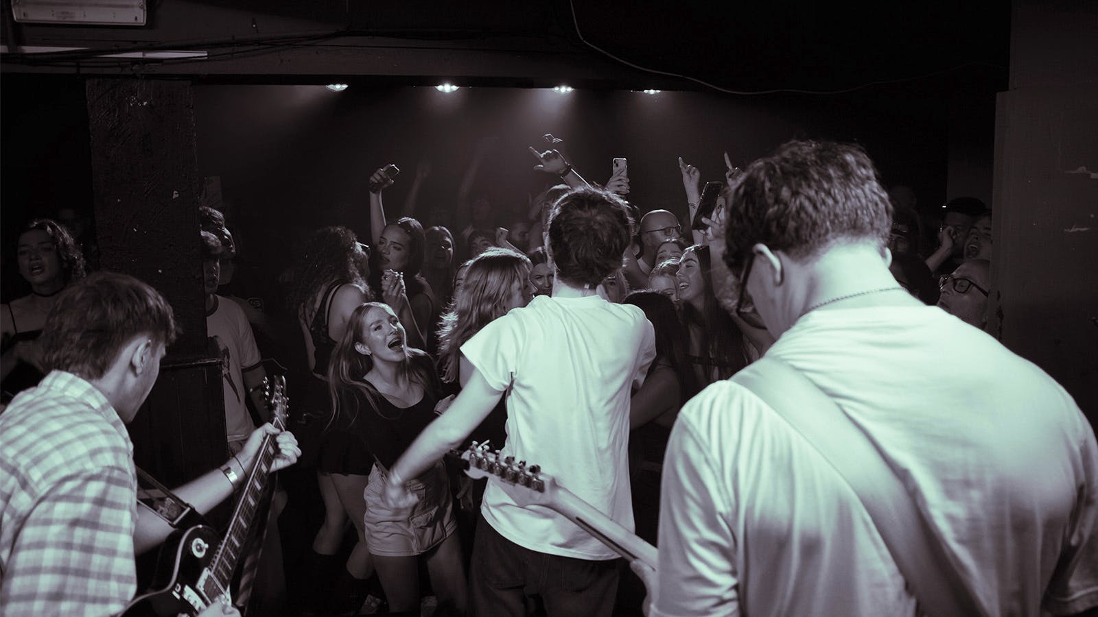 Vibrant live music event at The Deaf Institute lodge, showcasing audience engagement.