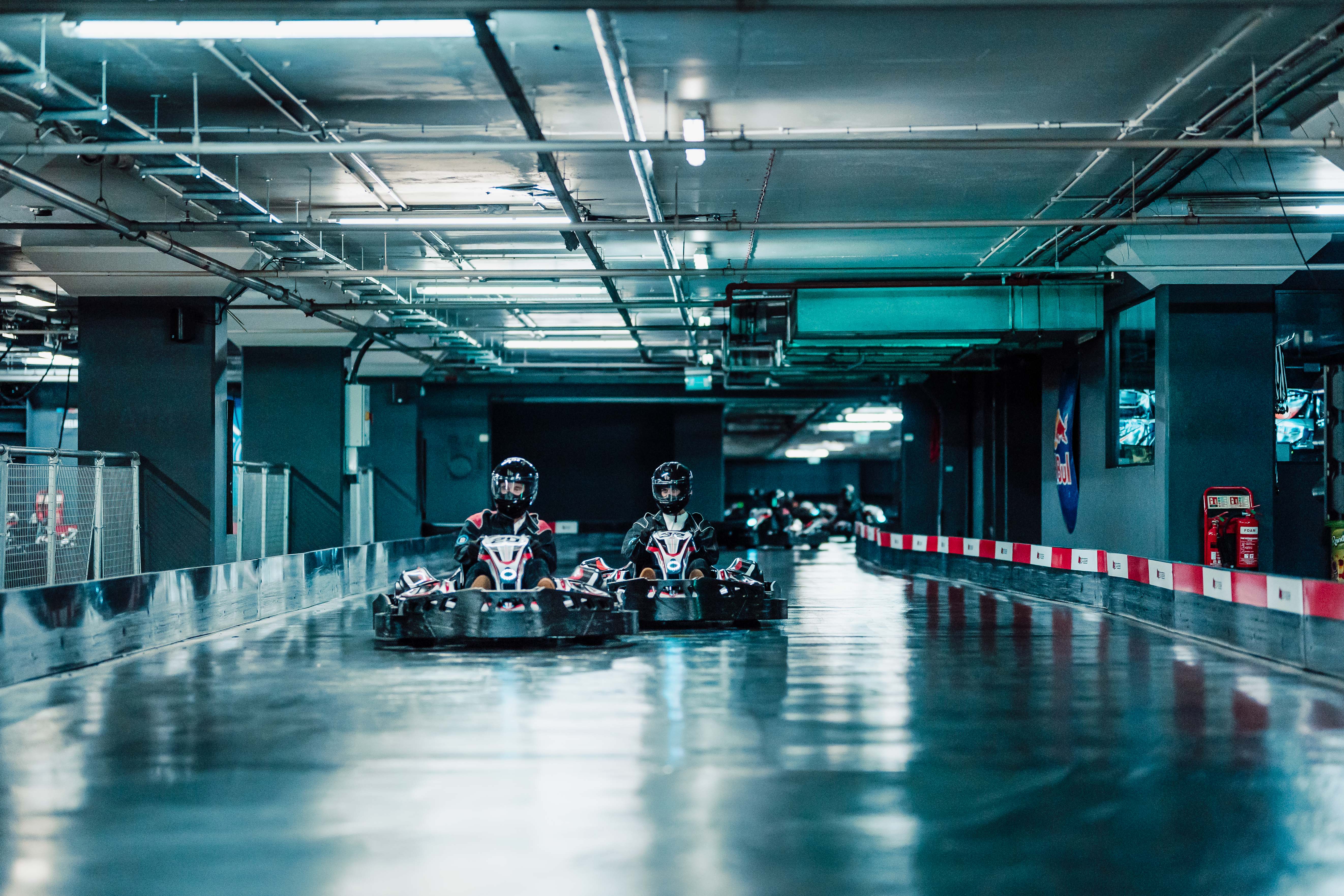 Vibrant go-karting venue at K1 Speed, ideal for corporate team-building events. - Banner