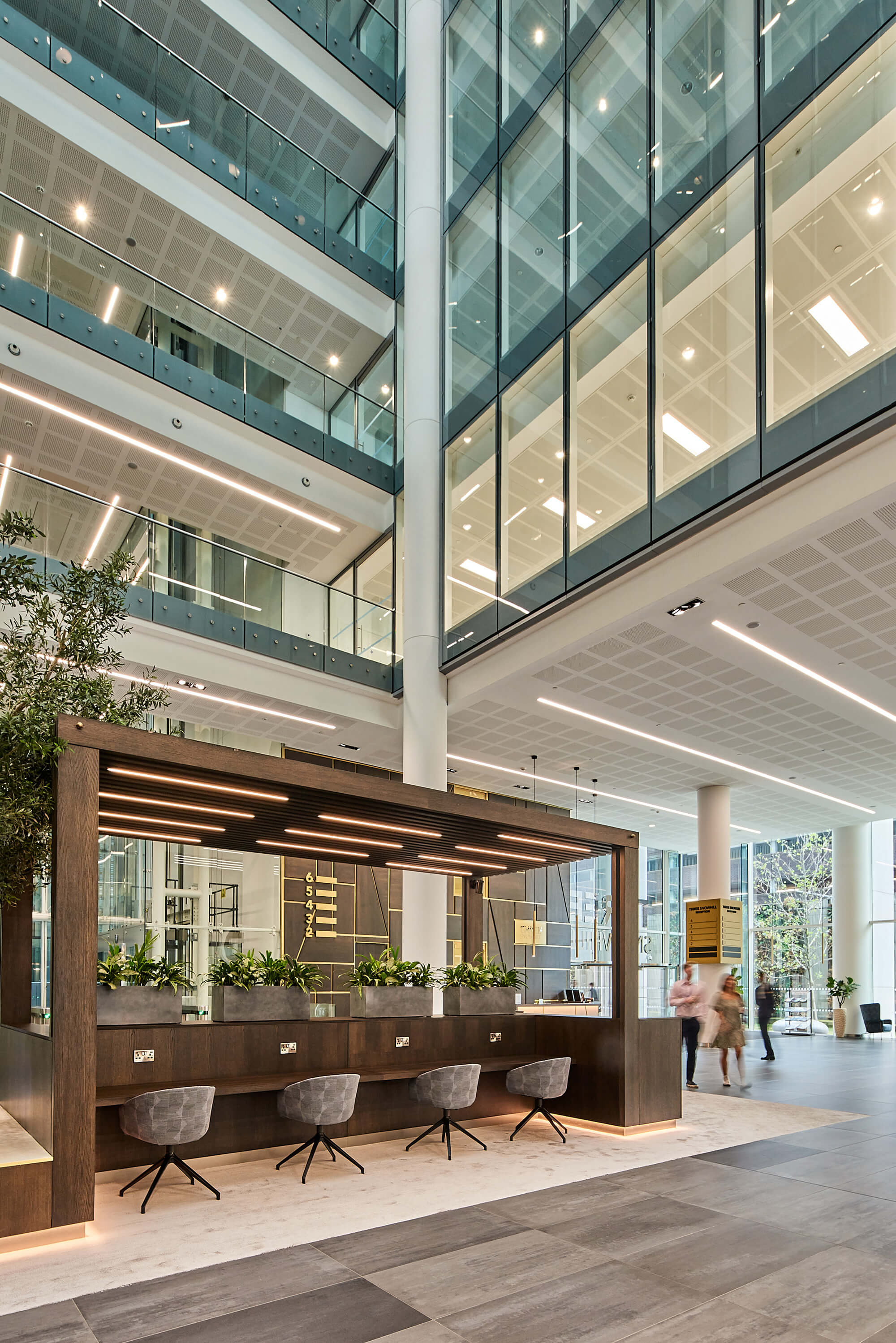 Modern Three Snowhill atrium reception space for corporate events and networking. - Banner