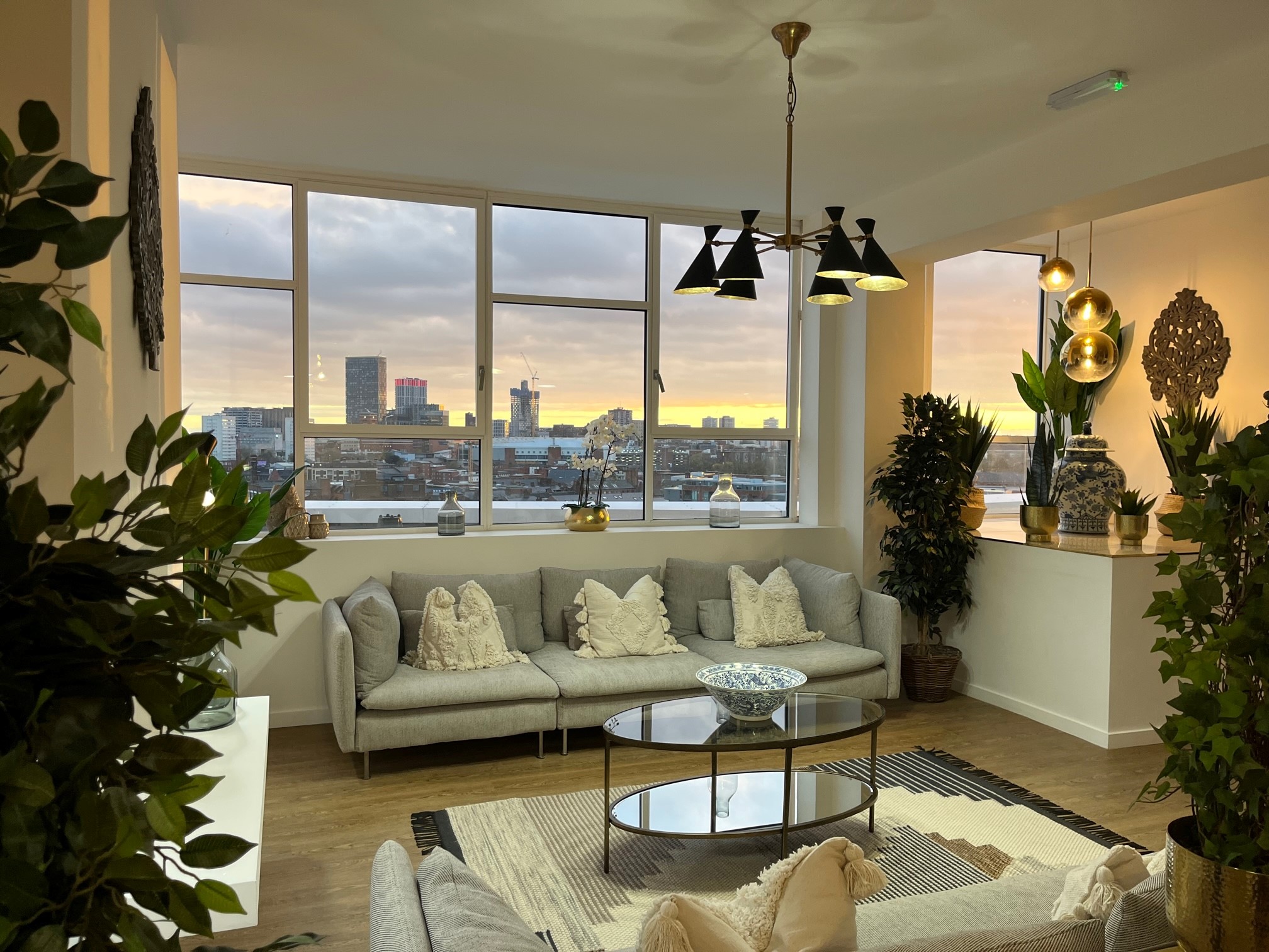 VIP roundtable board retreat at JQ Modern with premium furniture and skyline view.