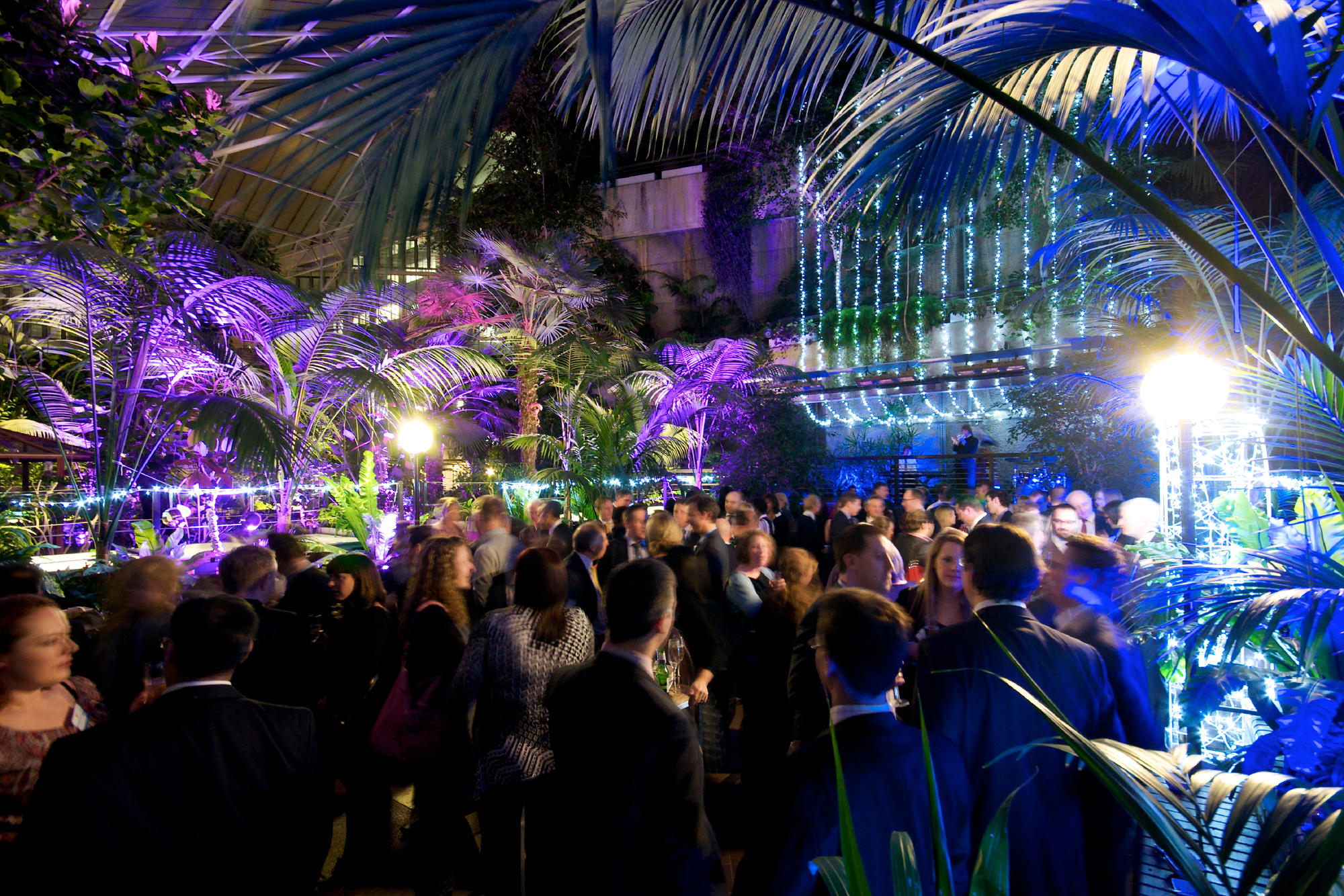 Lush outdoor Christmas party 2025 at Barbican Centre with vibrant lighting and guests.