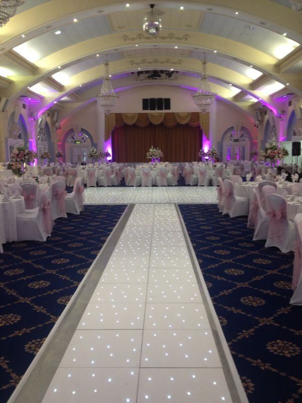 Elegant Penridge Suite event space with illuminated dance floor for weddings and galas. - Banner