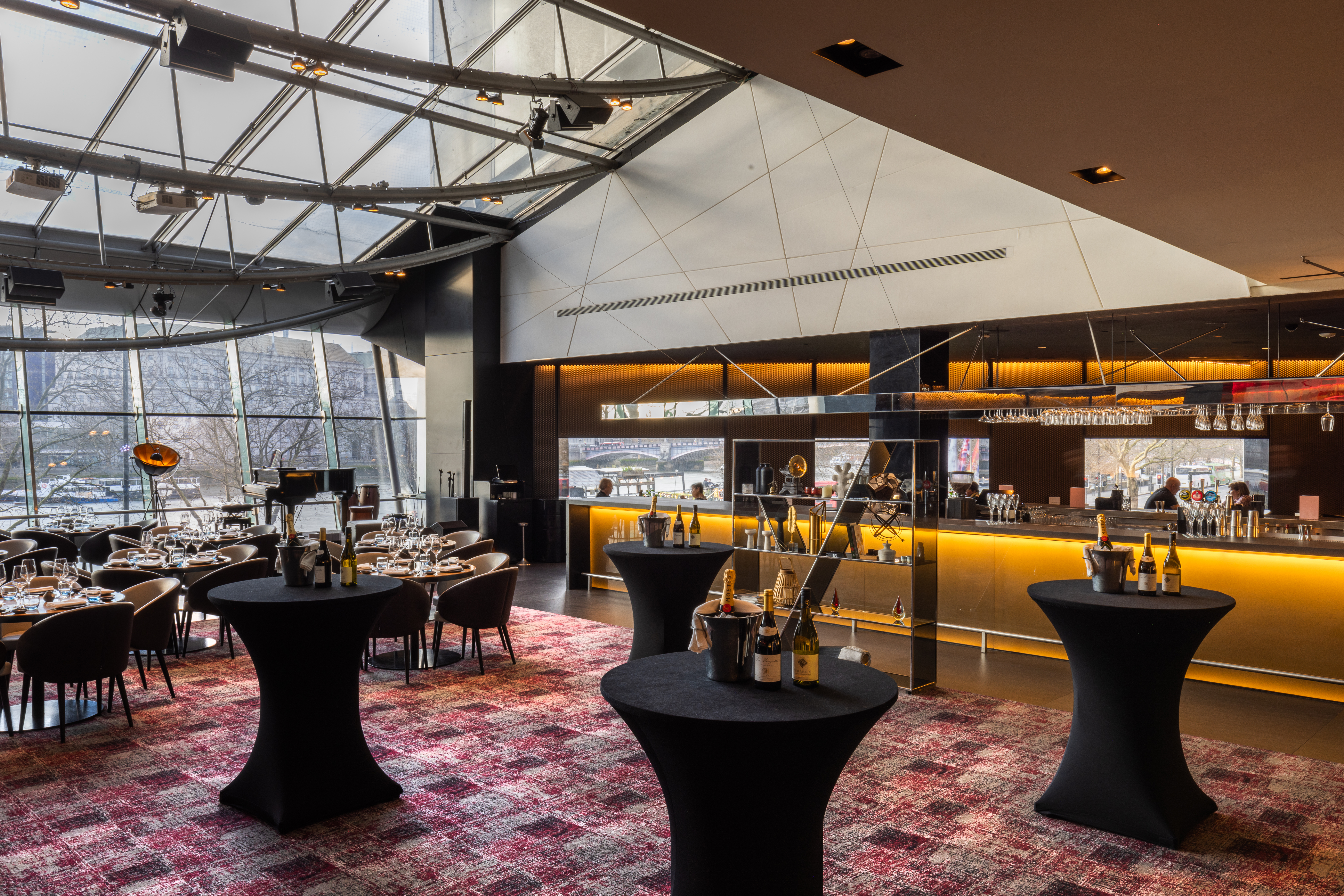 "Chino Latino event space with cocktail tables, ideal for corporate gatherings and parties."