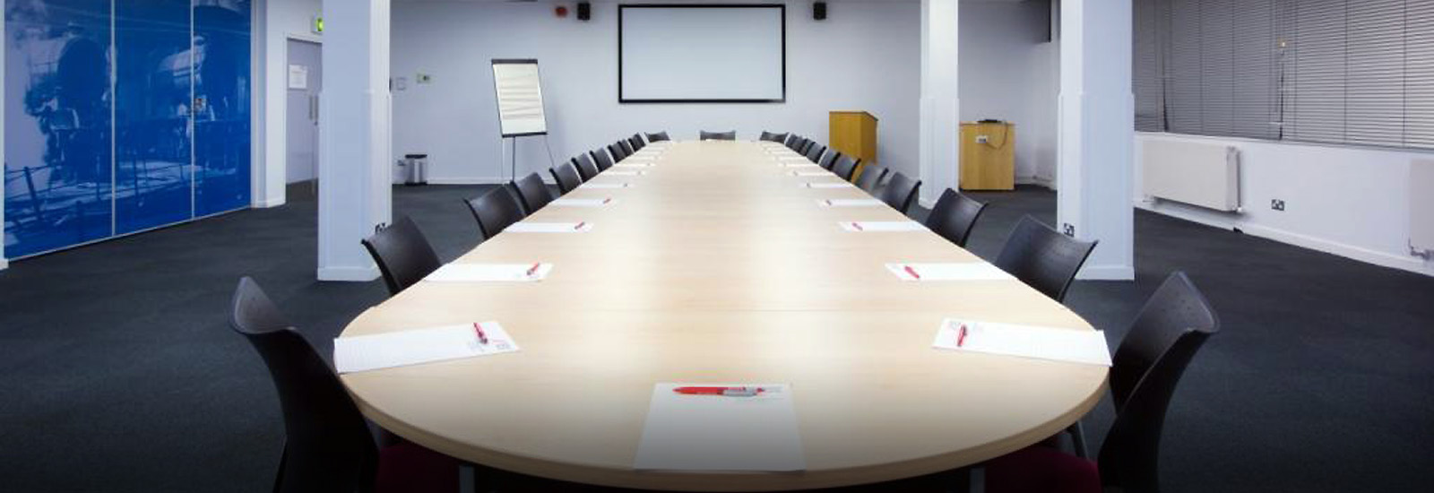 Mallard Suite meeting room with oval table, perfect for conferences and training sessions.