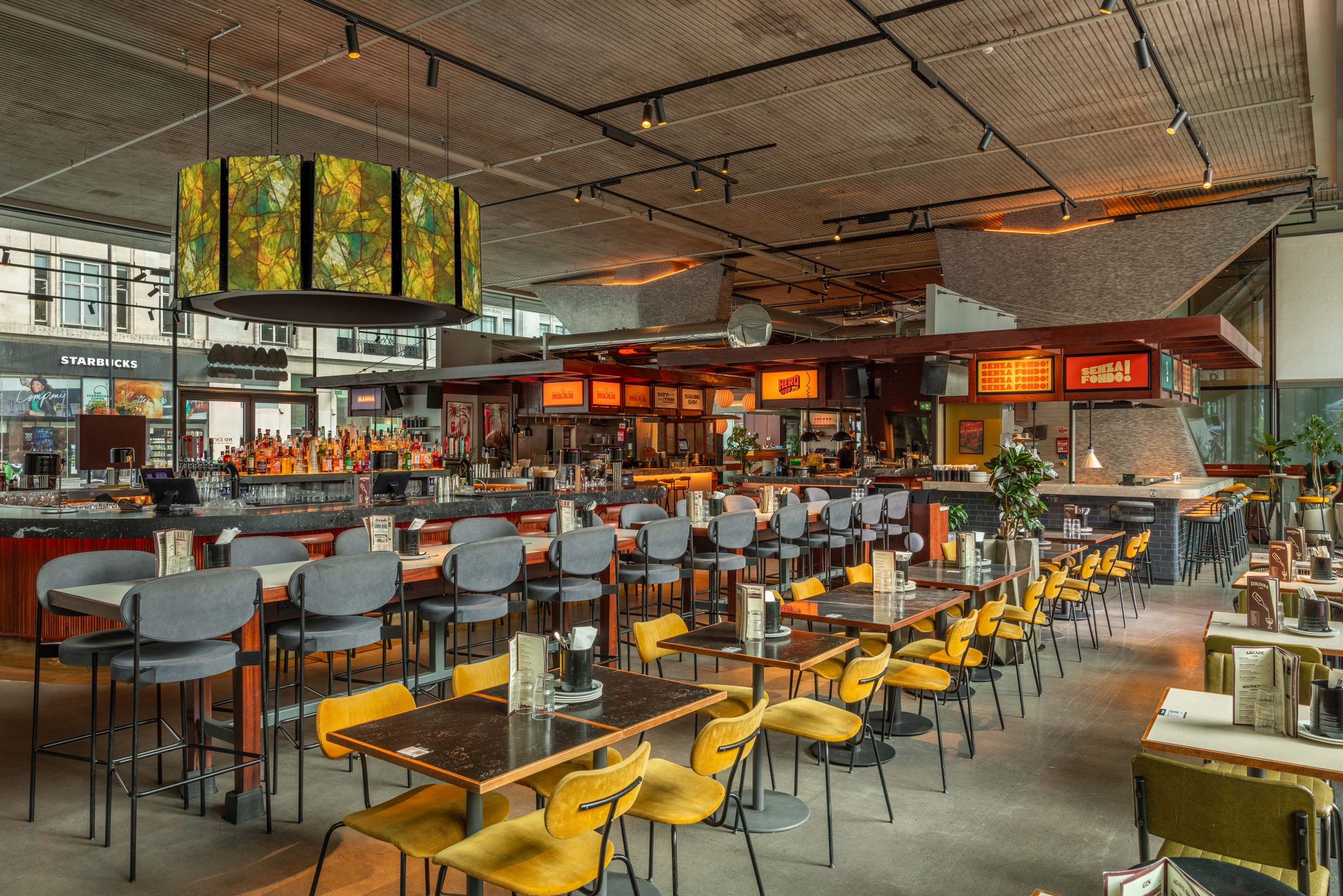 Modern restaurant venue with vibrant decor for meetings and networking events.