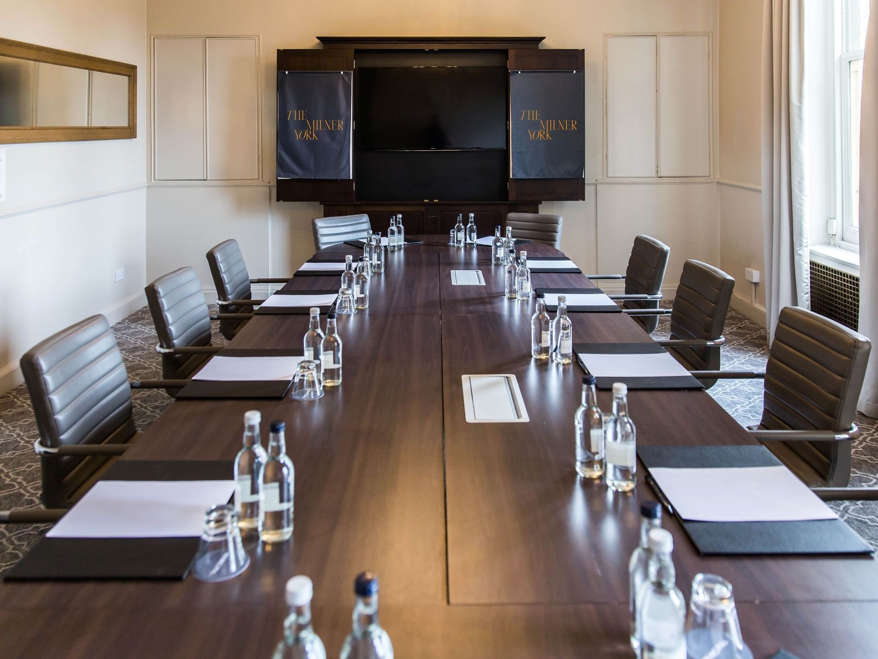Meeting room with wooden table and modern chairs for professional gatherings