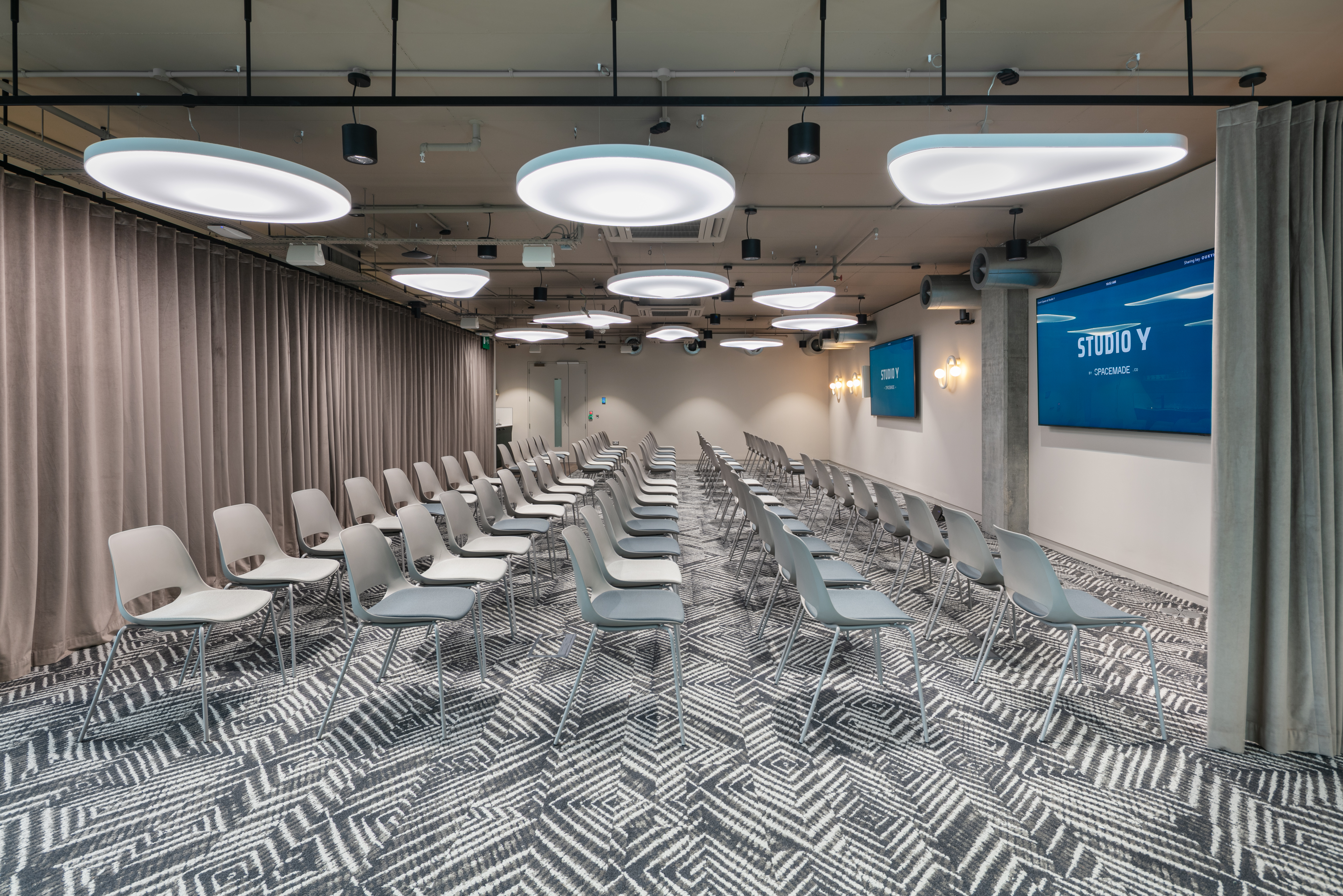 Theater-style breakout room at The Atrium with AV displays for corporate training and presentations.