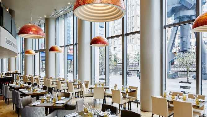 Modern restaurant interior at Manhattan Grill, ideal for events and dining in Canary Wharf.