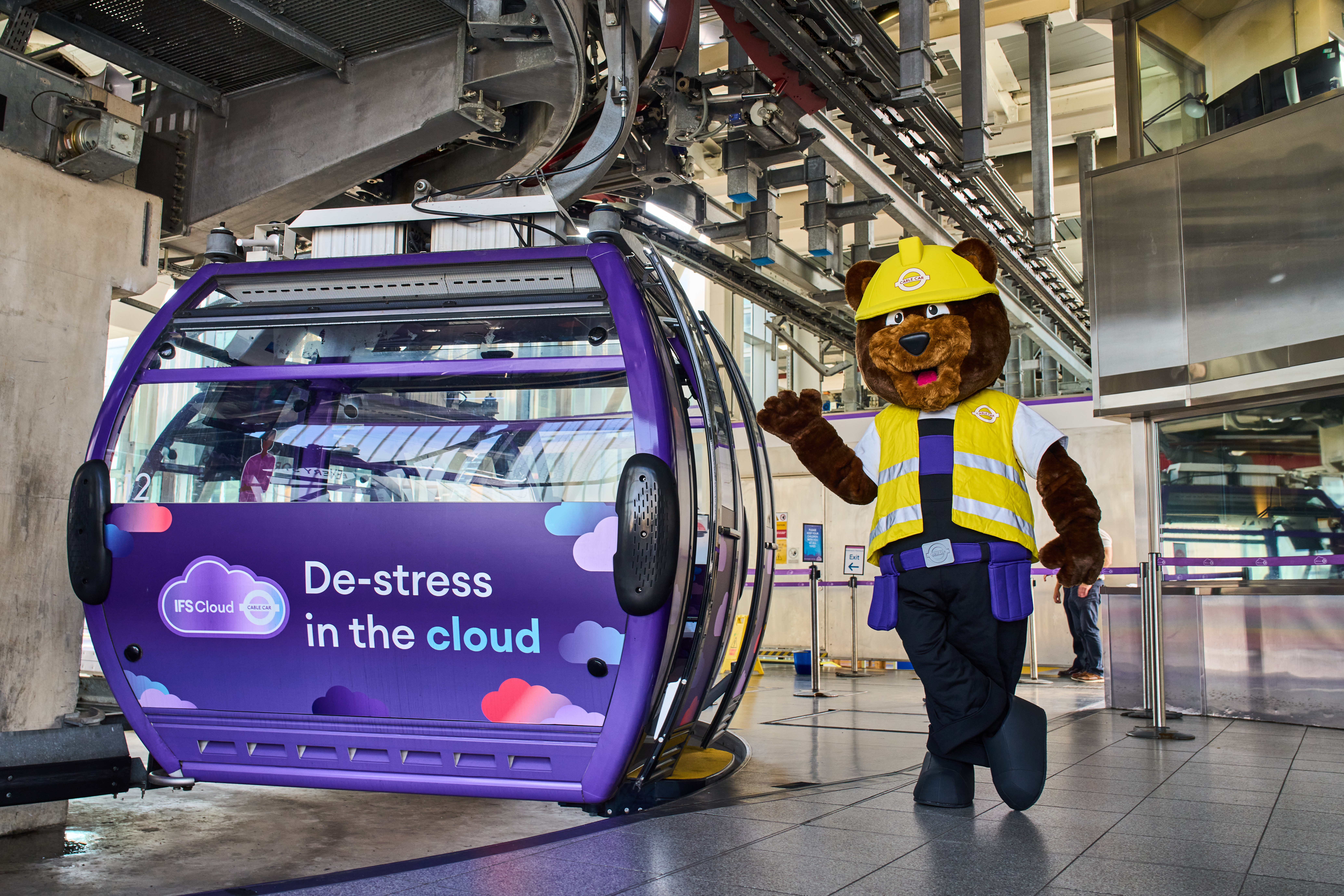 Cable car cabin in London with playful mascot for unique event experiences.