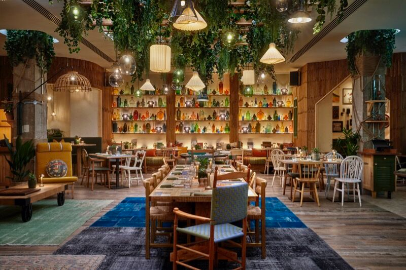 Pip at Treehouse Hotel Manchester dining space, warm lighting, corporate dinners, gatherings.