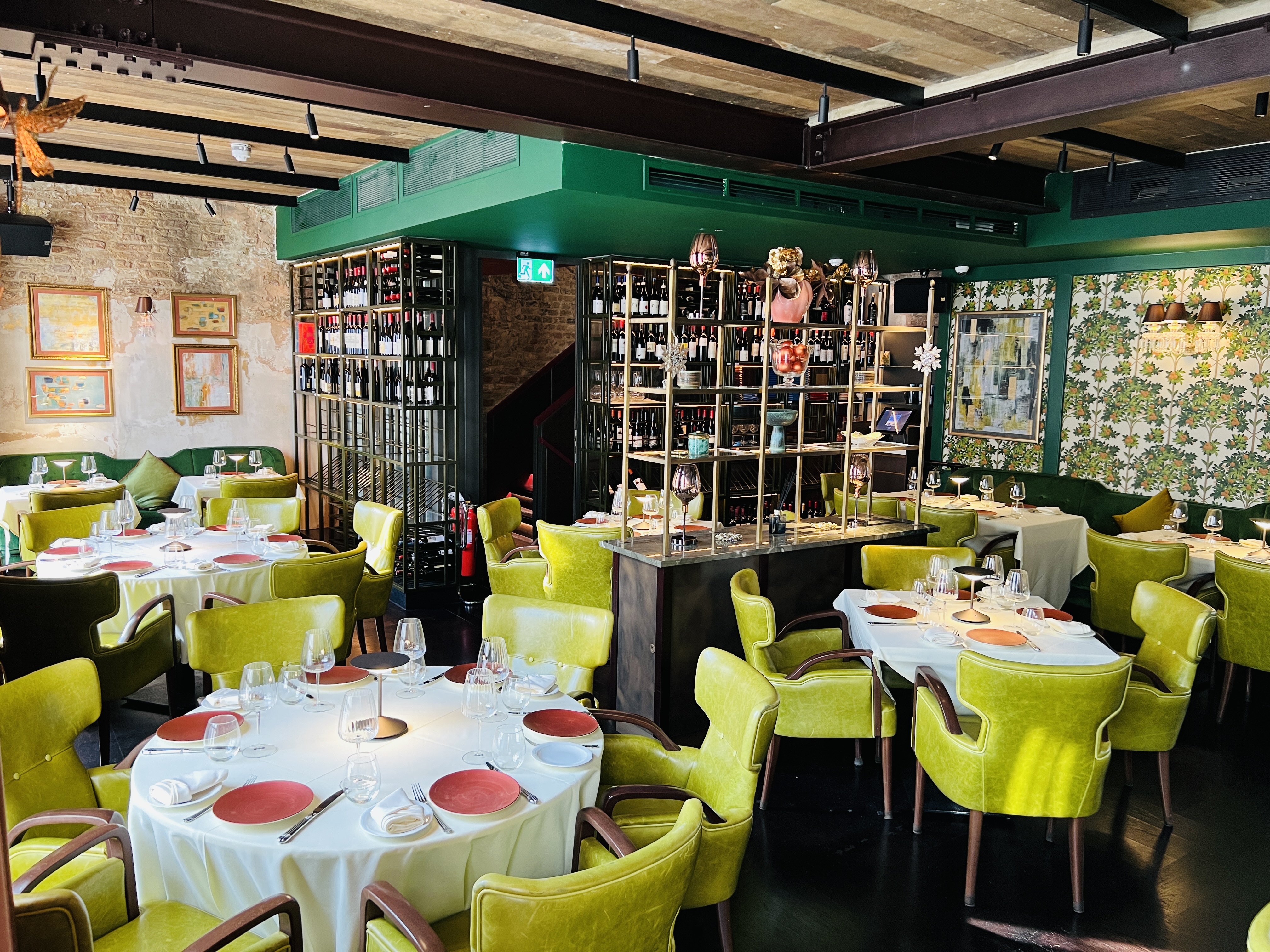 Upscale restaurant with lime-green seating for corporate dinners and networking events.
