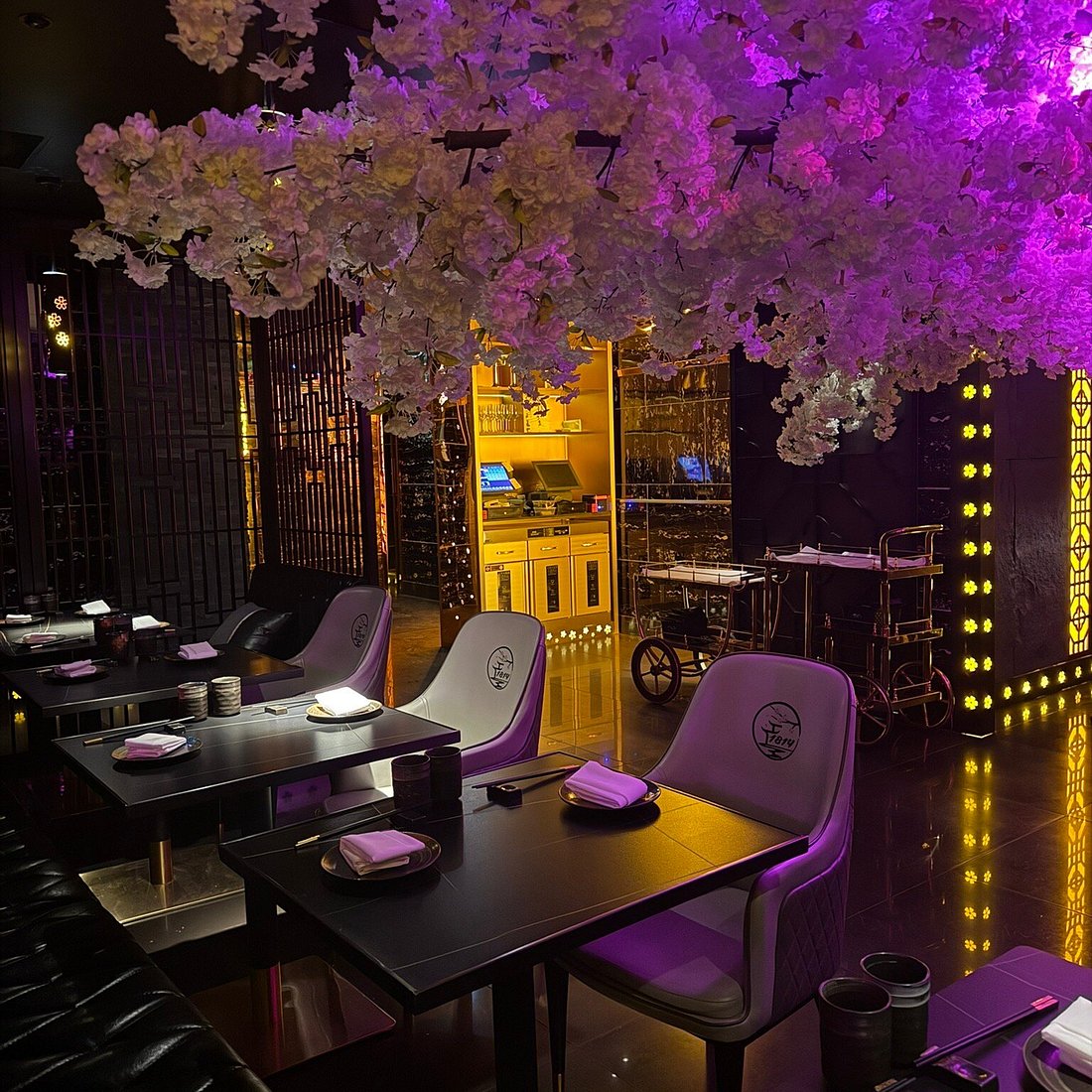 Elegant karaoke function room with floral installation for private events in Shanghai.