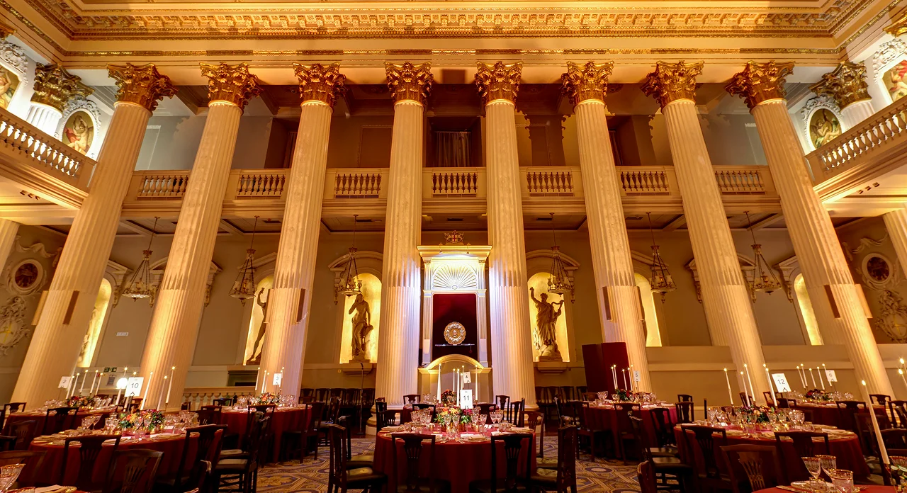 Elegant Egyptian Hall with grand columns, ideal for formal gala events. - Banner