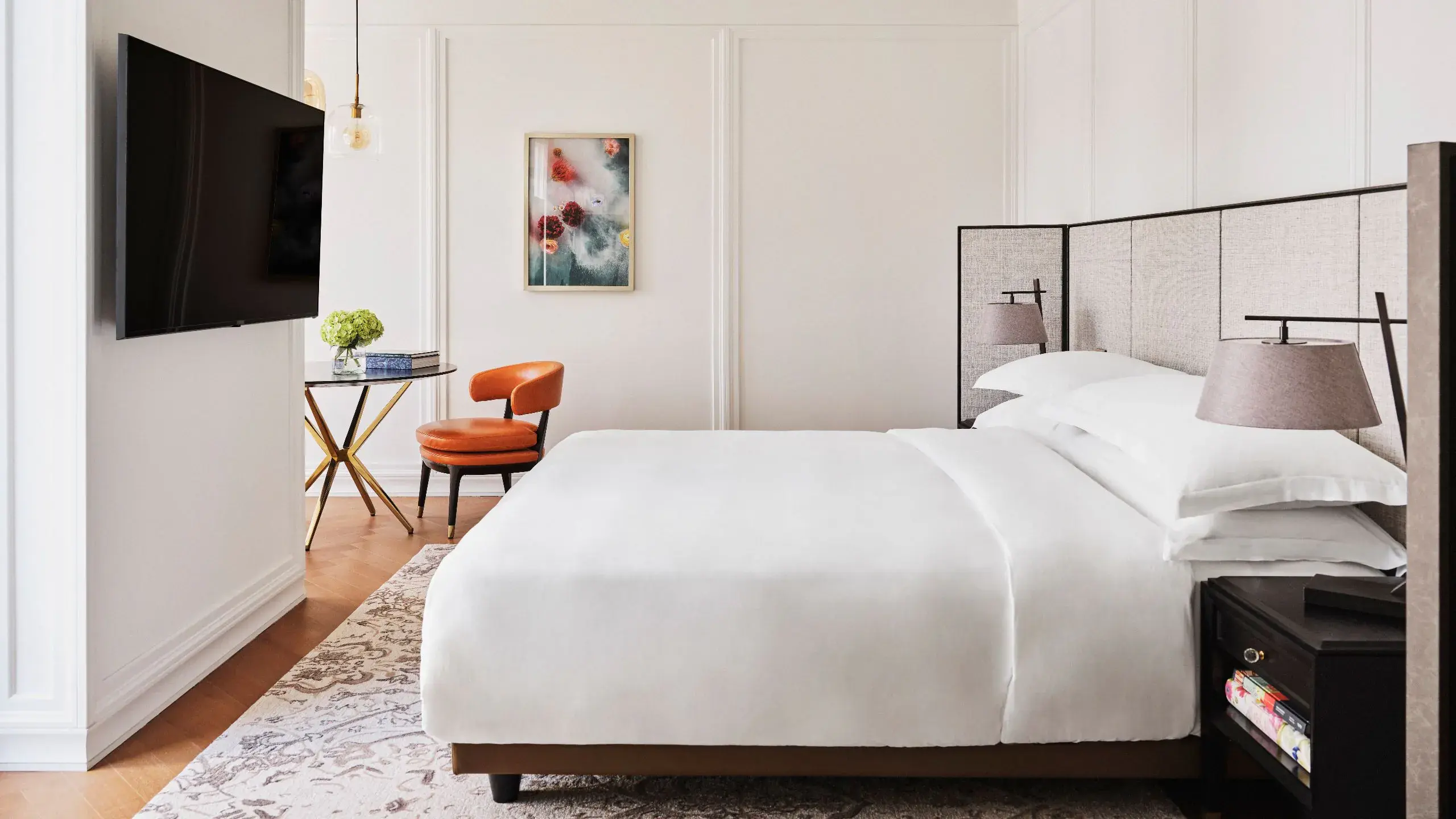 Modern luxury hotel bedroom with workstation, ideal for executive retreats and VIP events.