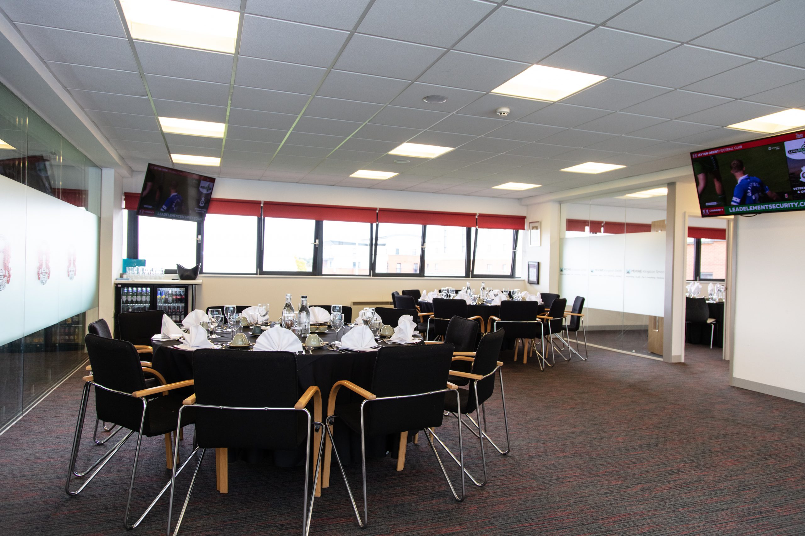 Private dining setup in Orient Lounge with elegant tables for meetings and events. - Banner